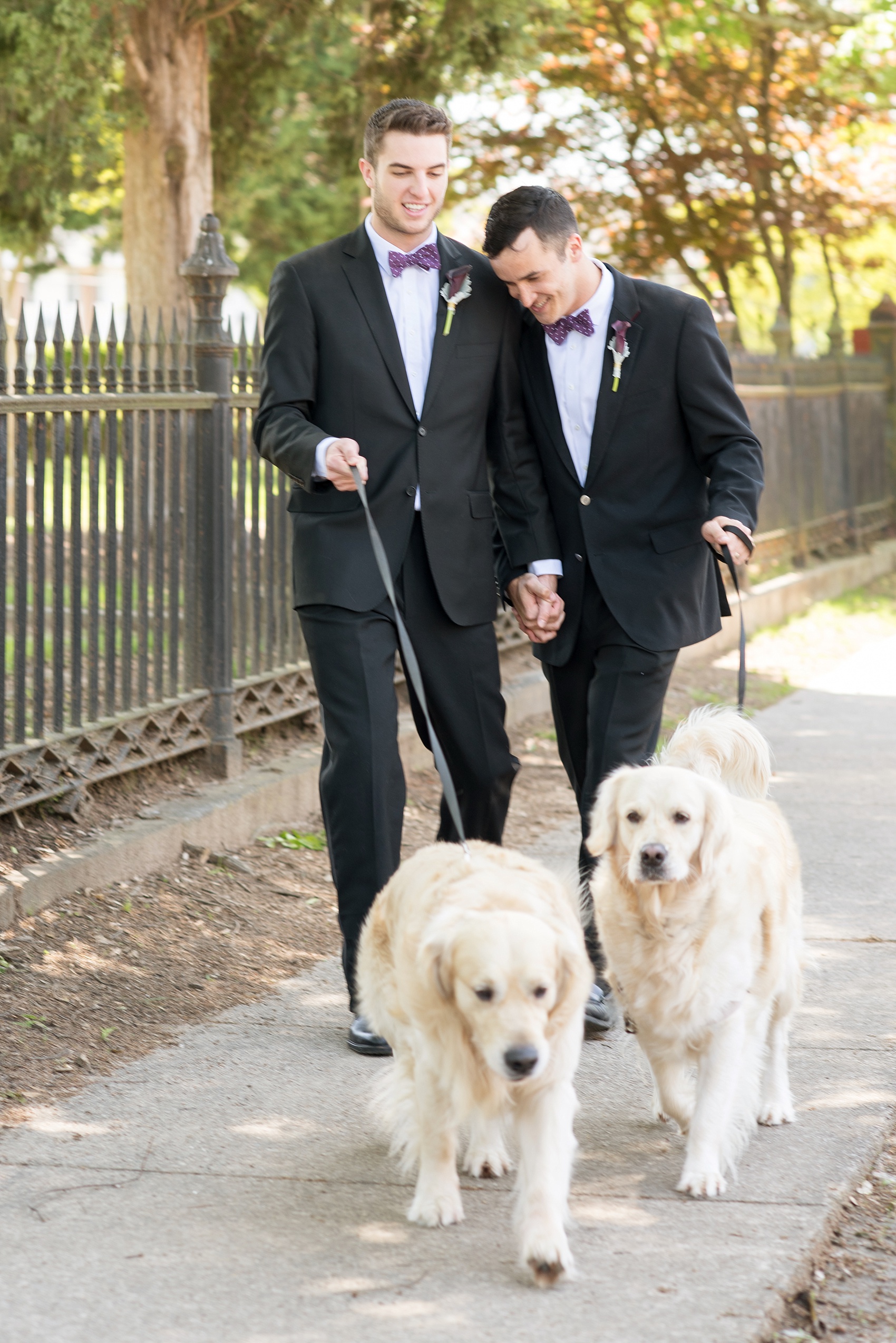 Mikkel Paige Photography pictures of a Raleigh, NC wedding at All Saints Chapel. Gay inspiration with two grooms and their golden retriever dogs.