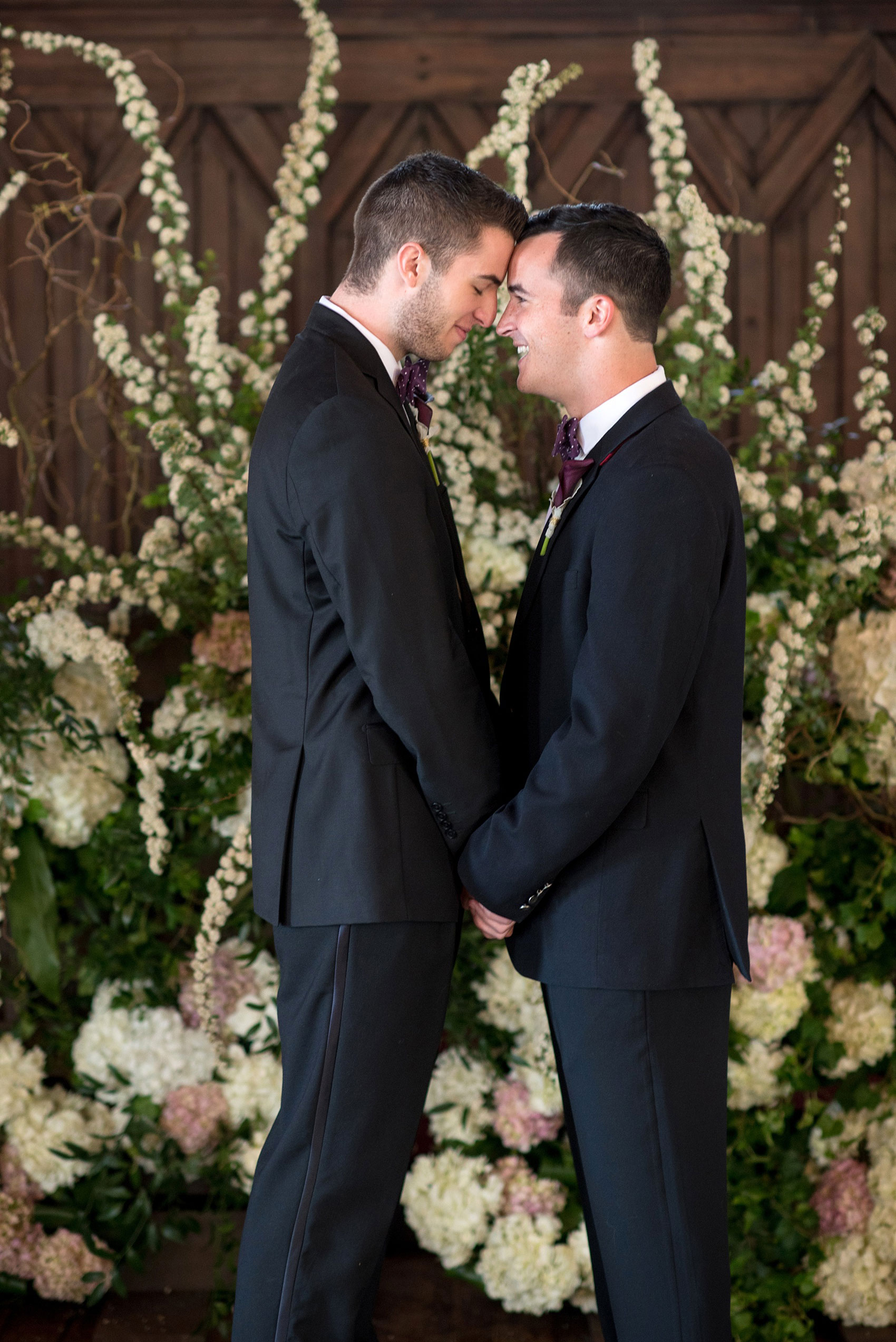 Mikkel Paige Photography pictures of a gay All Saints Chapel wedding in Raleigh, NC. Purple, black and white inspiration with two grooms.