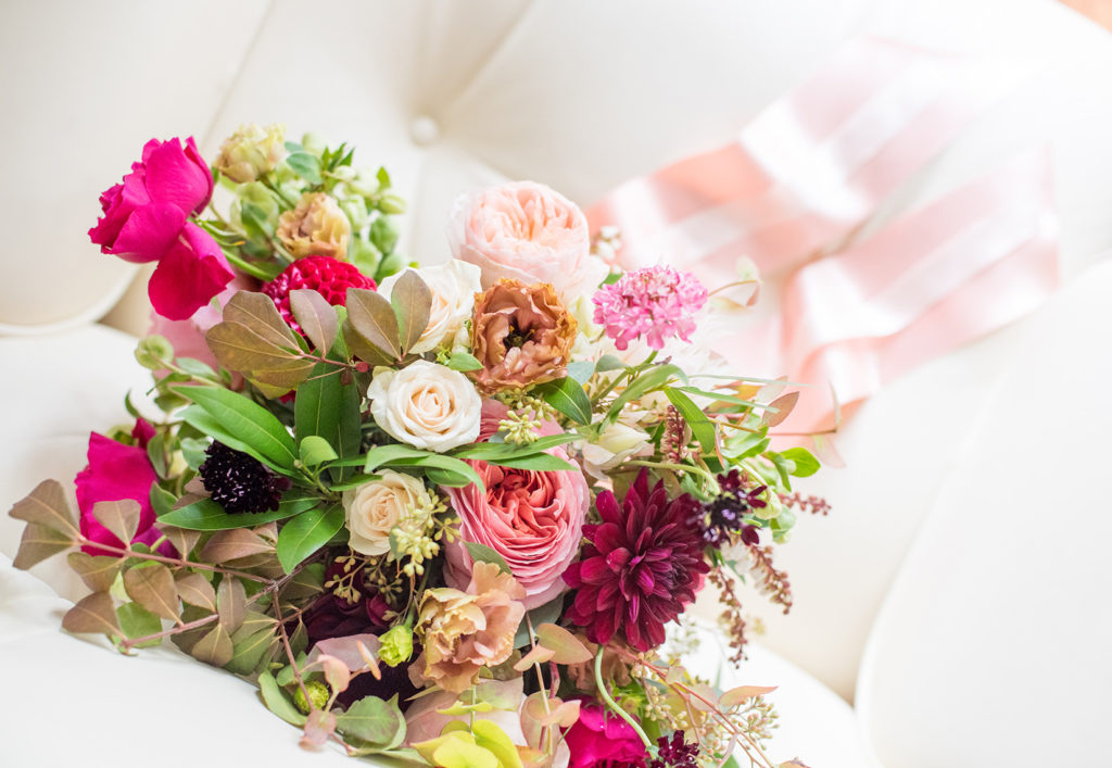 Mikkel Paige Photography photos from a wedding at Prospect Park Boathouse in Brooklyn. The colorful summer bouquet was created by Sachi Rose.