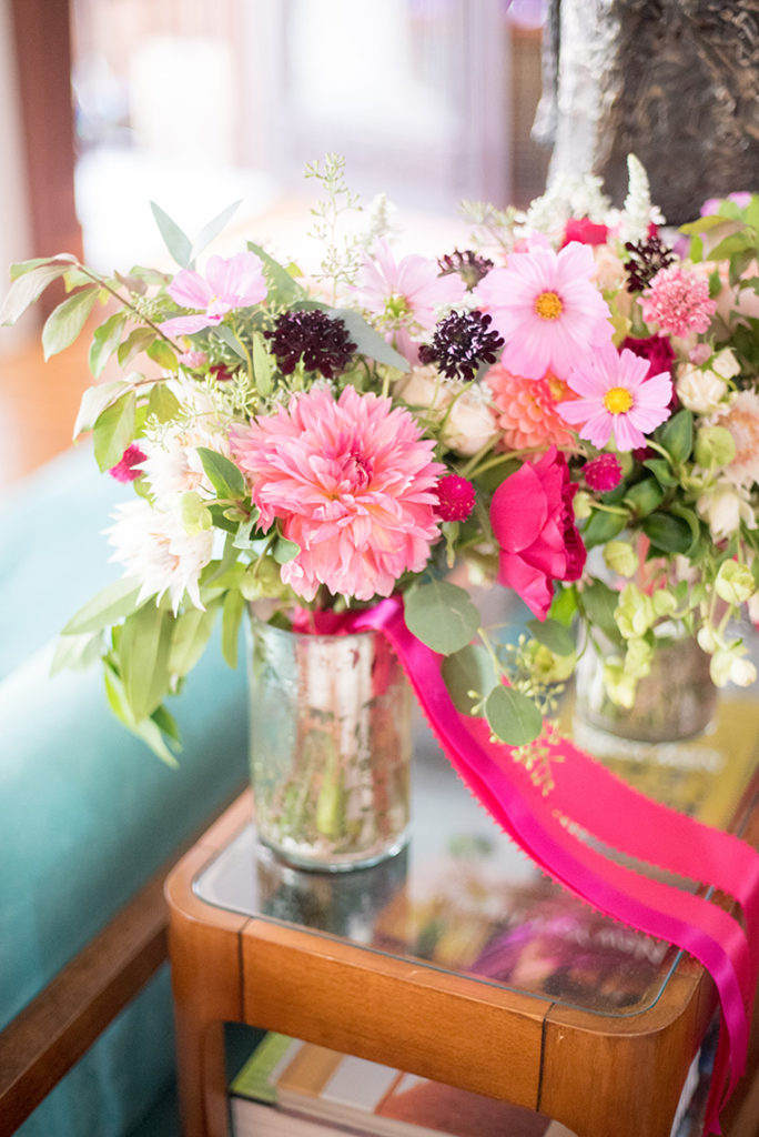Mikkel Paige Photography photos from a wedding at Prospect Park Boathouse in Brooklyn. Colorful bridesmaids bouquets by Sachi Rose.