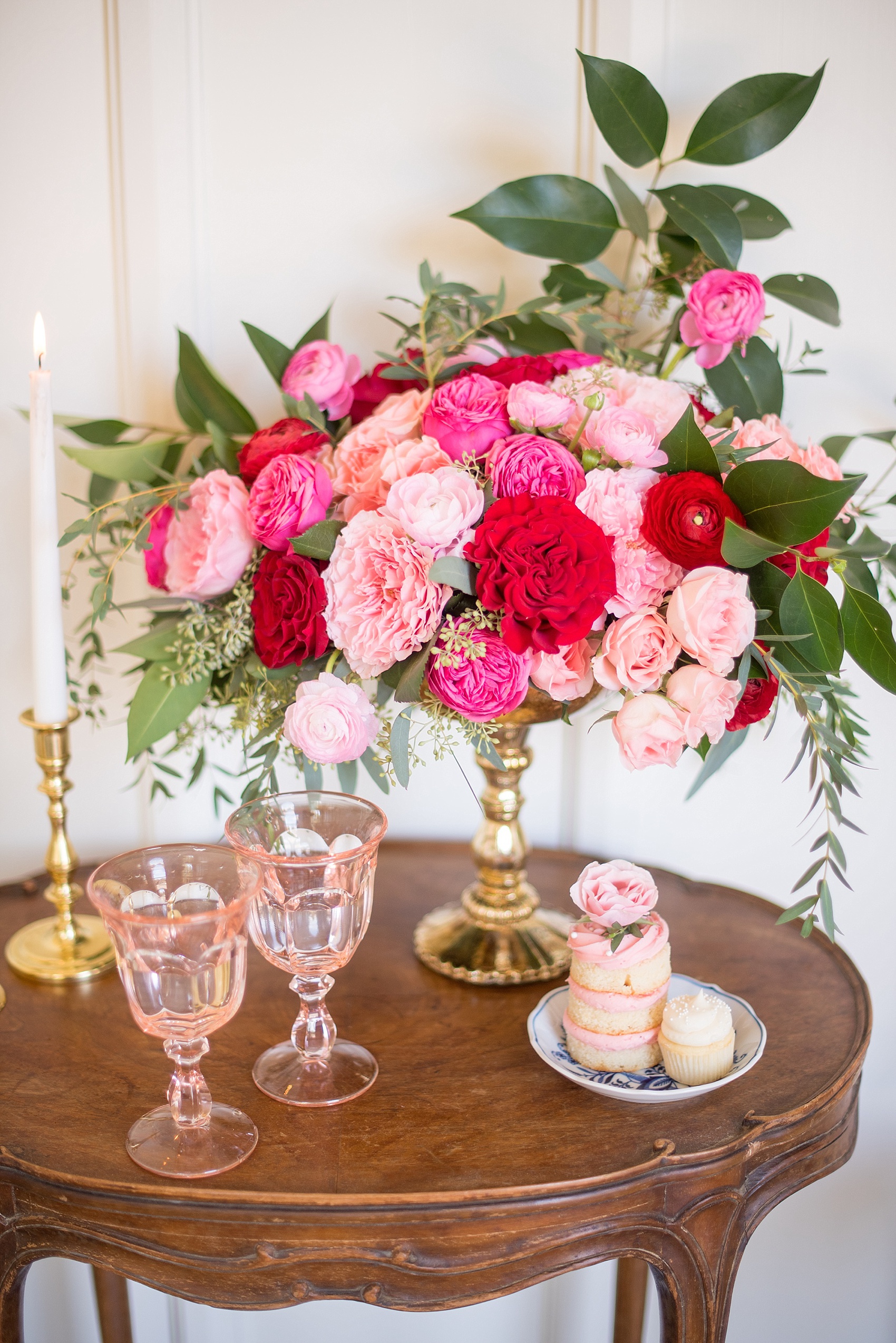 All Saints Chapel Raleigh bridal photos with an inspirational tea for Valentine's Day with pink and red flowers and colored glasses from Greenhouse Picker Sisters.