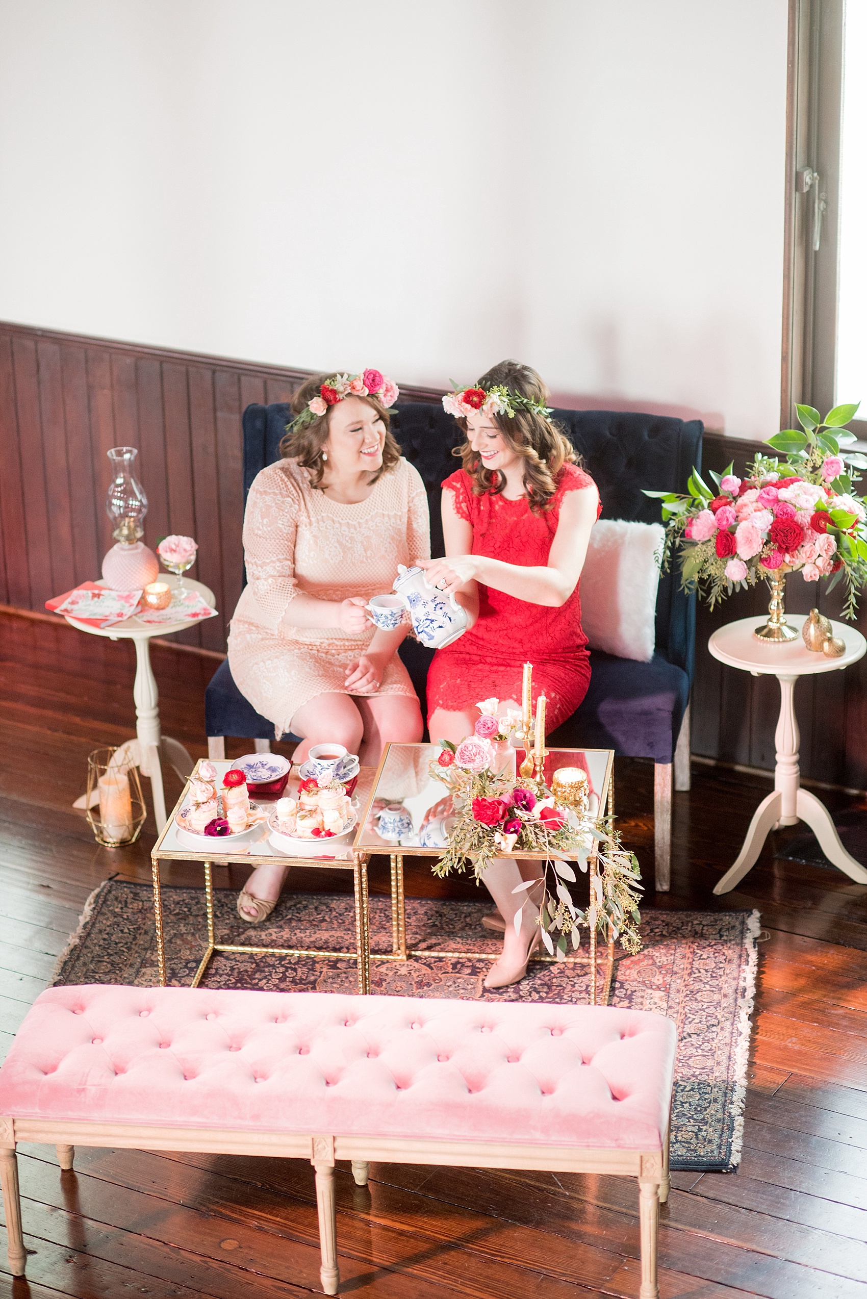 All Saints Chapel Raleigh bridal photos with an inspirational tea for Galentine's Day with pink and red cakelets.