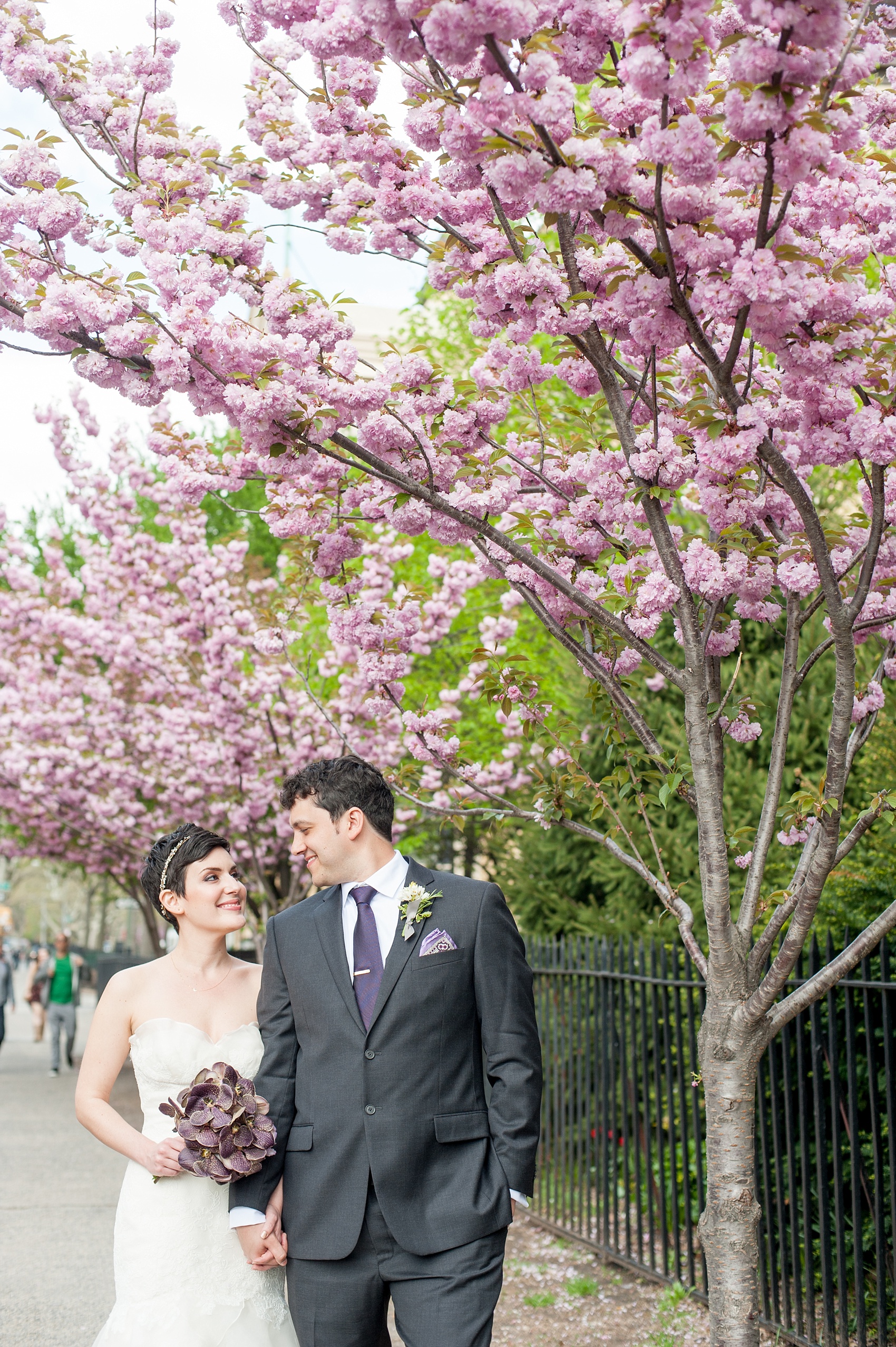 Mikkel Paige Photography Brooklyn Winery wedding photos. Cherry blossoms in spring and deep purple jewel tones on an orchid bouquet.