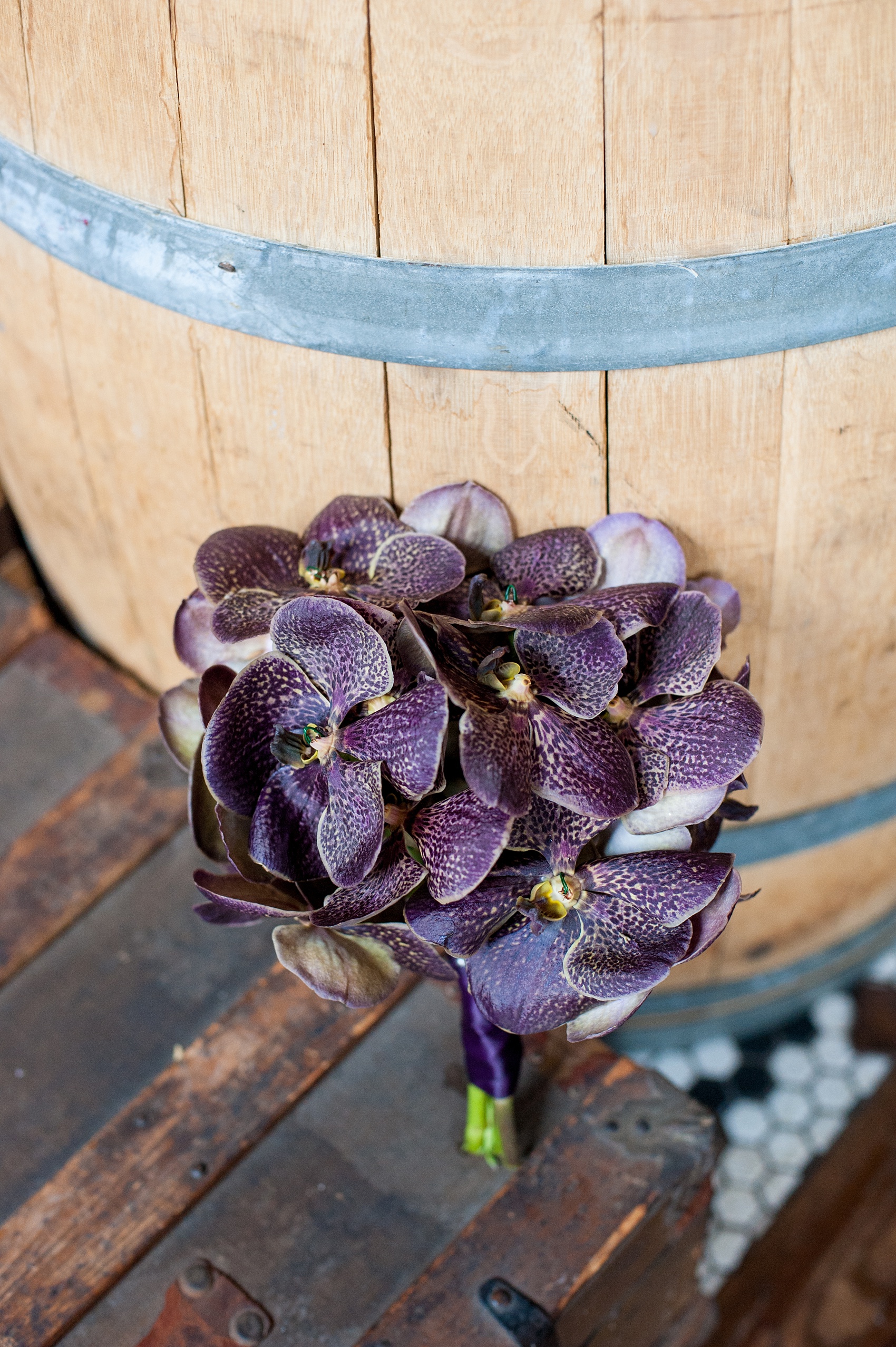 Mikkel Paige Photography Brooklyn Winery wedding photos. Detail picture of a unique deep purple jewel tone all orchid bouquet.