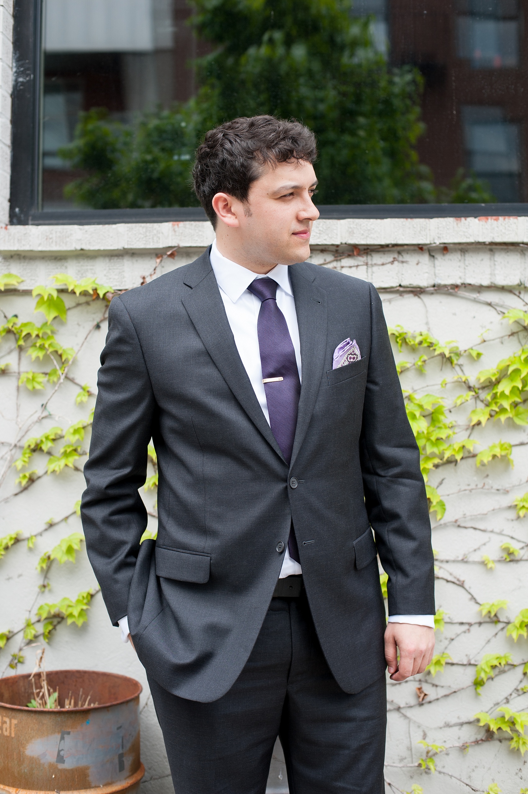 Mikkel Paige Photography Brooklyn Winery wedding photos. Picture of the groom in a custom suite and deep purple jewel tone tie.