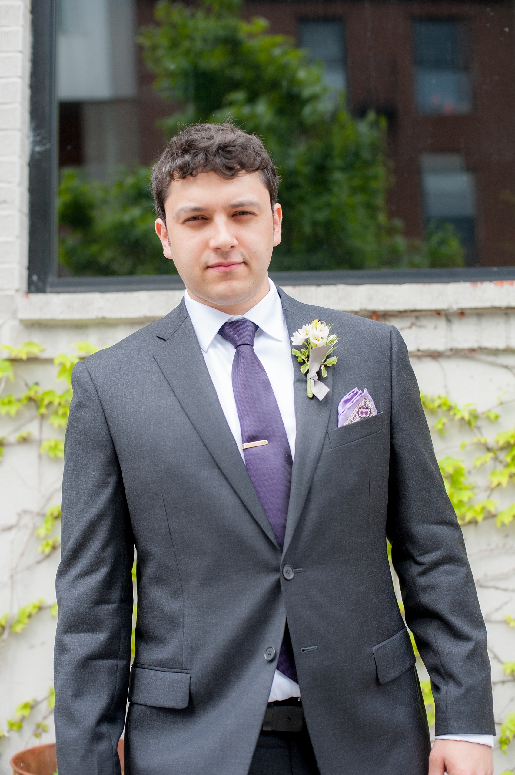 Mikkel Paige Photography Brooklyn Winery wedding photos. Picture of the groom in a custom suite and deep purple jewel tone tie.