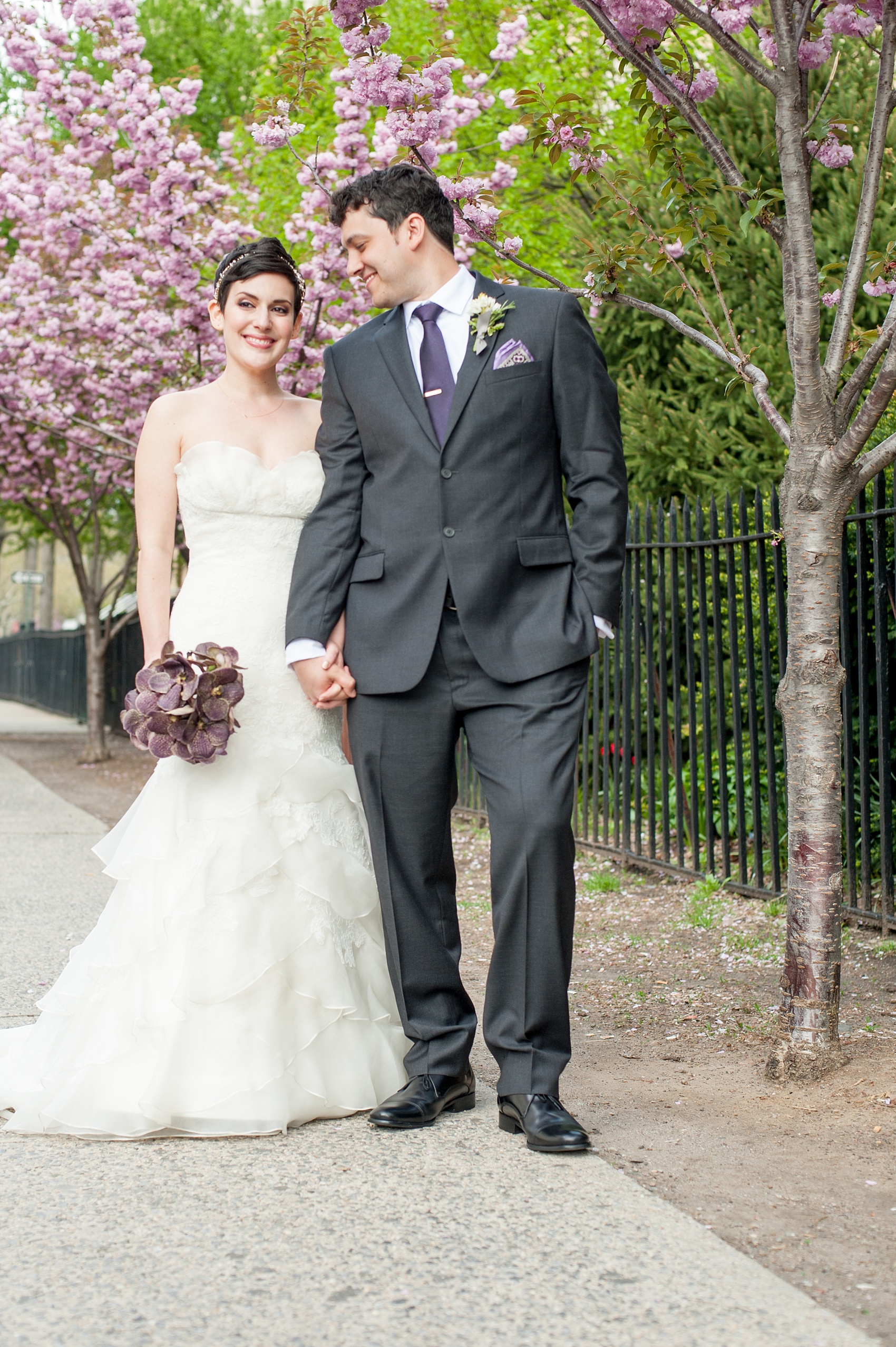 Mikkel Paige Photography Brooklyn Winery wedding photos. Cherry blossoms in spring and deep purple jewel tones on an orchid bouquet.