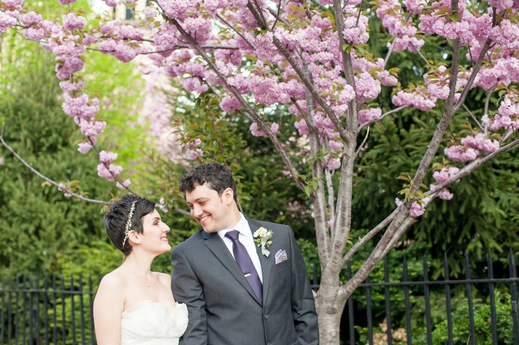 Mikkel Paige Photography Brooklyn Winery wedding photos. Cherry blossoms in spring and deep purple jewel tones on an orchid bouquet.