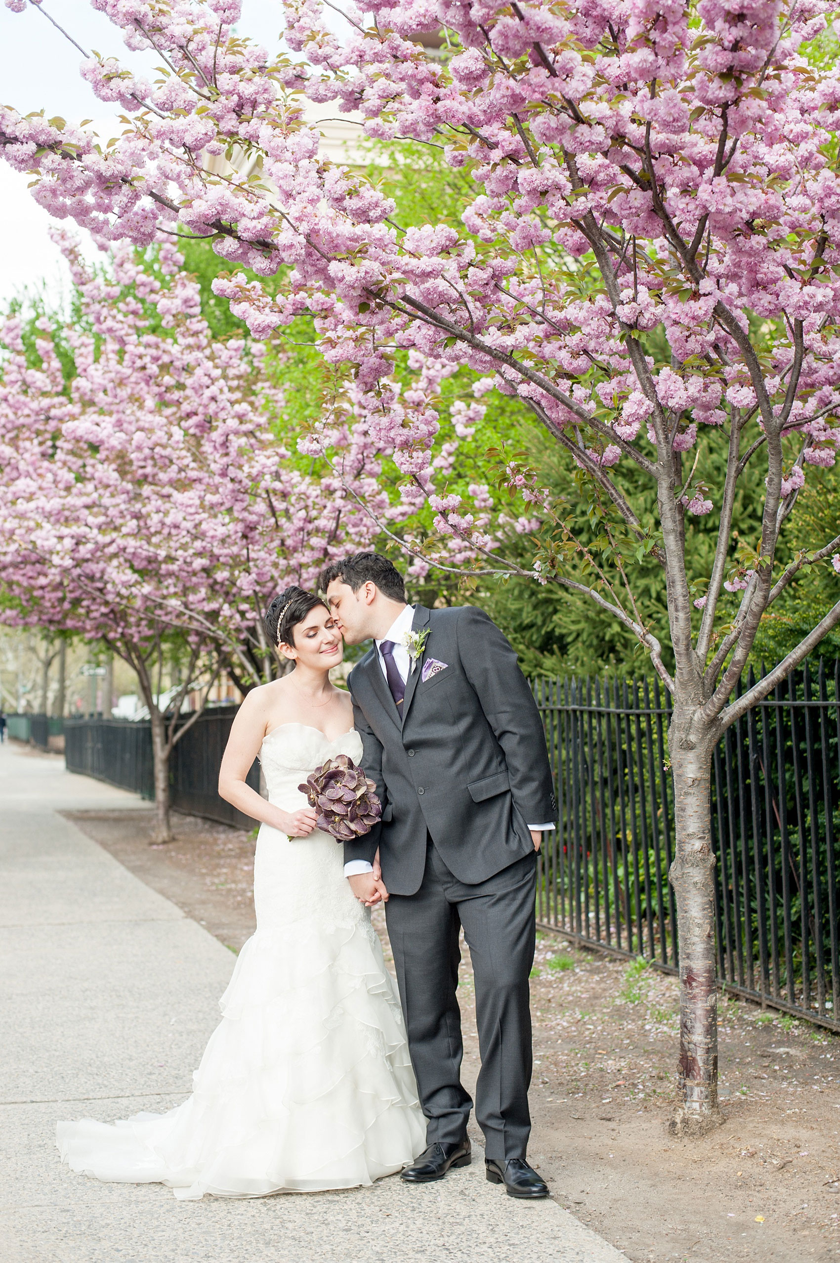 Mikkel Paige Photography Brooklyn Winery wedding photos. Cherry blossoms in spring and deep purple jewel tones on an orchid bouquet.