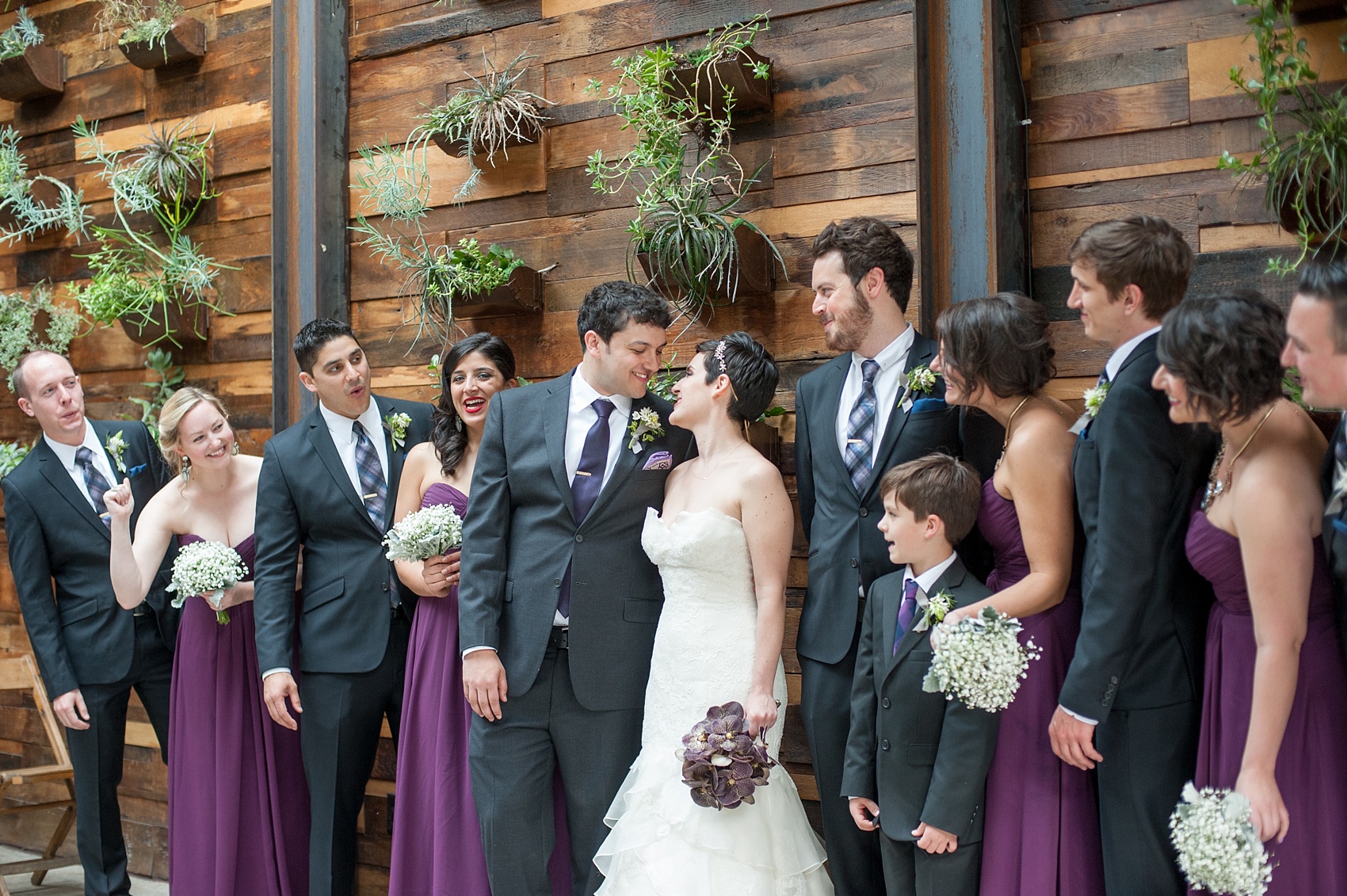 Mikkel Paige Photography Brooklyn Winery wedding photos. Picture of the wedding party, with the bridesmaids in purple chiffon gowns.