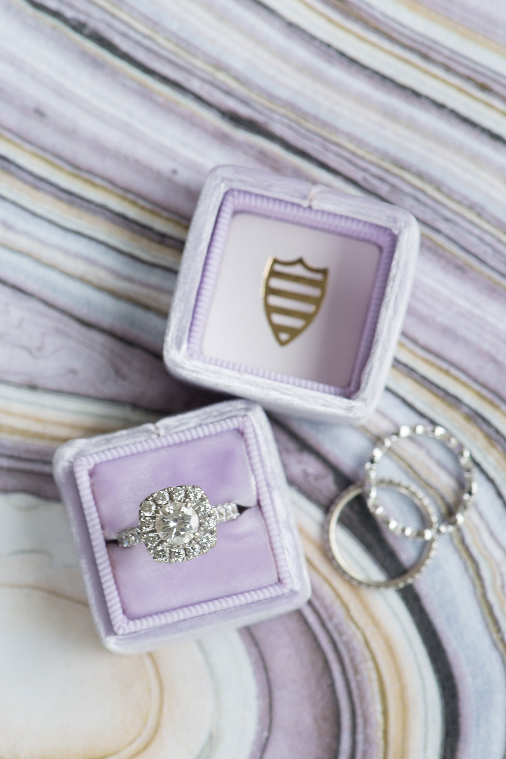 Mikkel Paige Photography images of a Rose Hill Plantation wedding inspiration with a lavender velvet engagement Mrs. Ring box and diamond rings in North Carolina. 