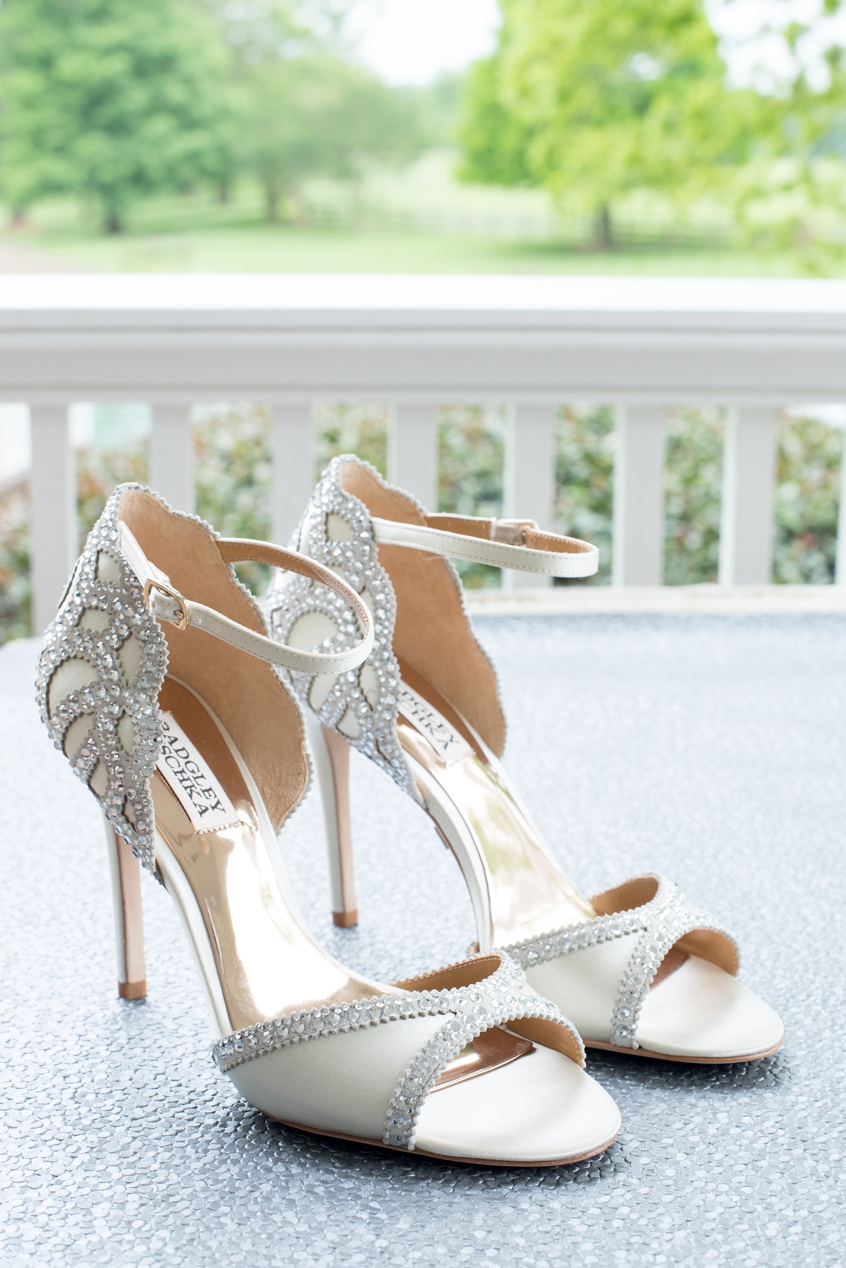 Mikkel Paige Photography images of a Rose Hill Plantation wedding inspiration. Photos of a pair of rhinestone Badgley Mischka heels for the bride. 