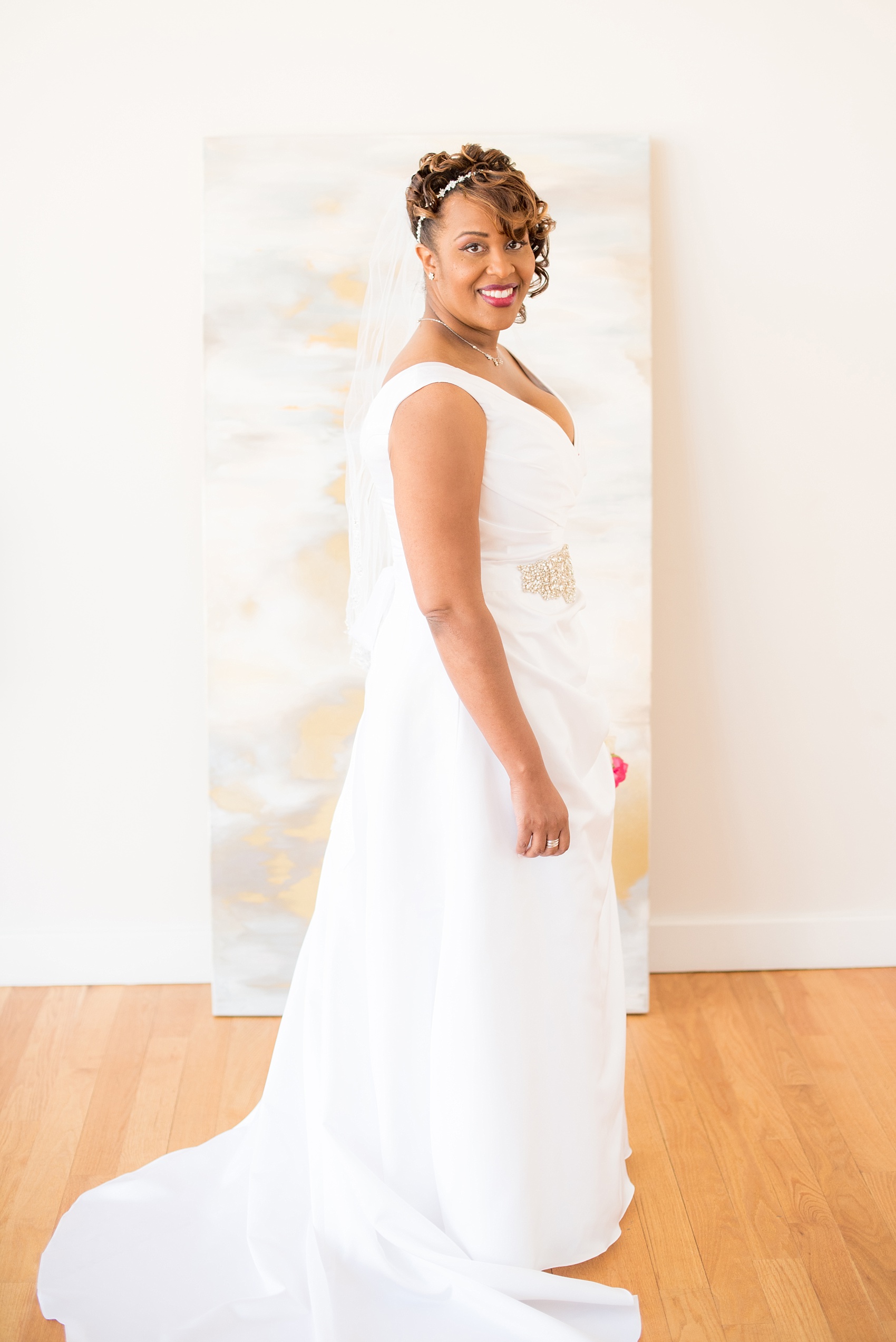 Mikkel Paige Photography photos of a small wedding at The Stockroom at 230 in downtown Raleigh, North Carolina. Image of the bride in The Glass Box.