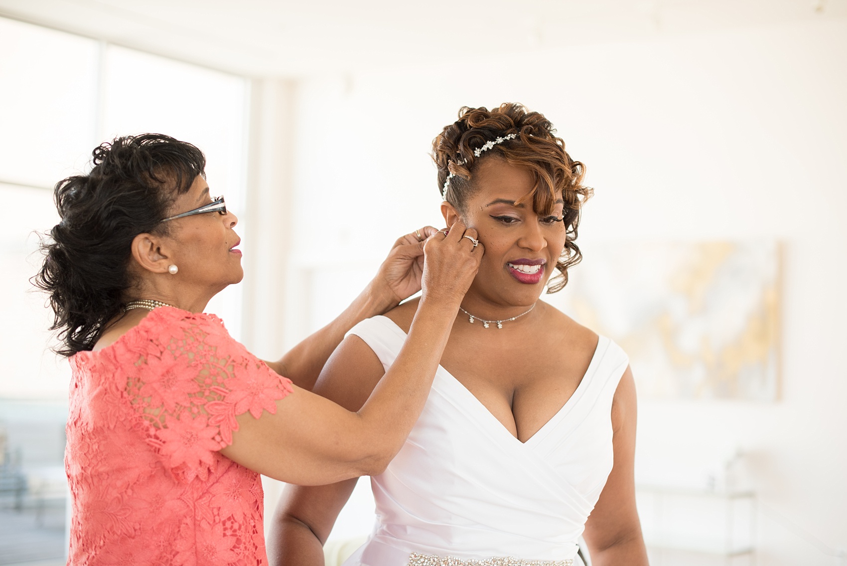 Mikkel Paige Photography photos of a small wedding at The Stockroom at 230 in downtown Raleigh, North Carolina. Image of the bride and her mom getting ready in The Glass Box.