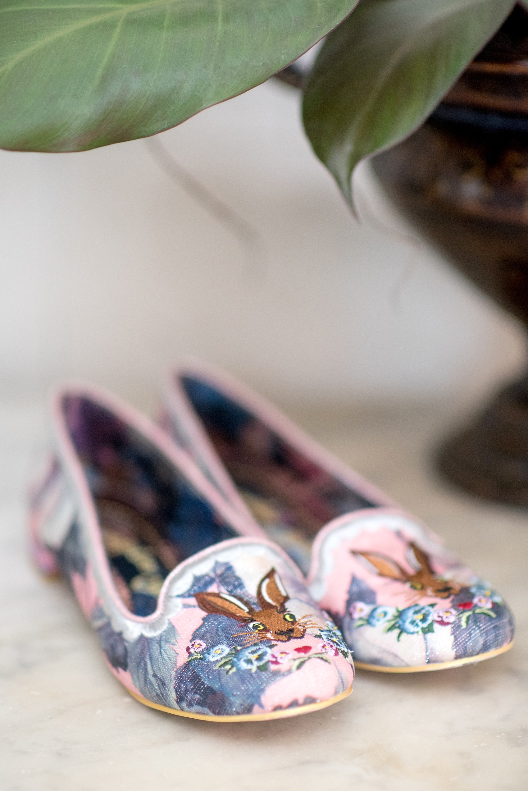 The Sutherland Wedding Photos by Mikkel Paige Photography. A detail picture of the bride's creative rabbit flat shoes.