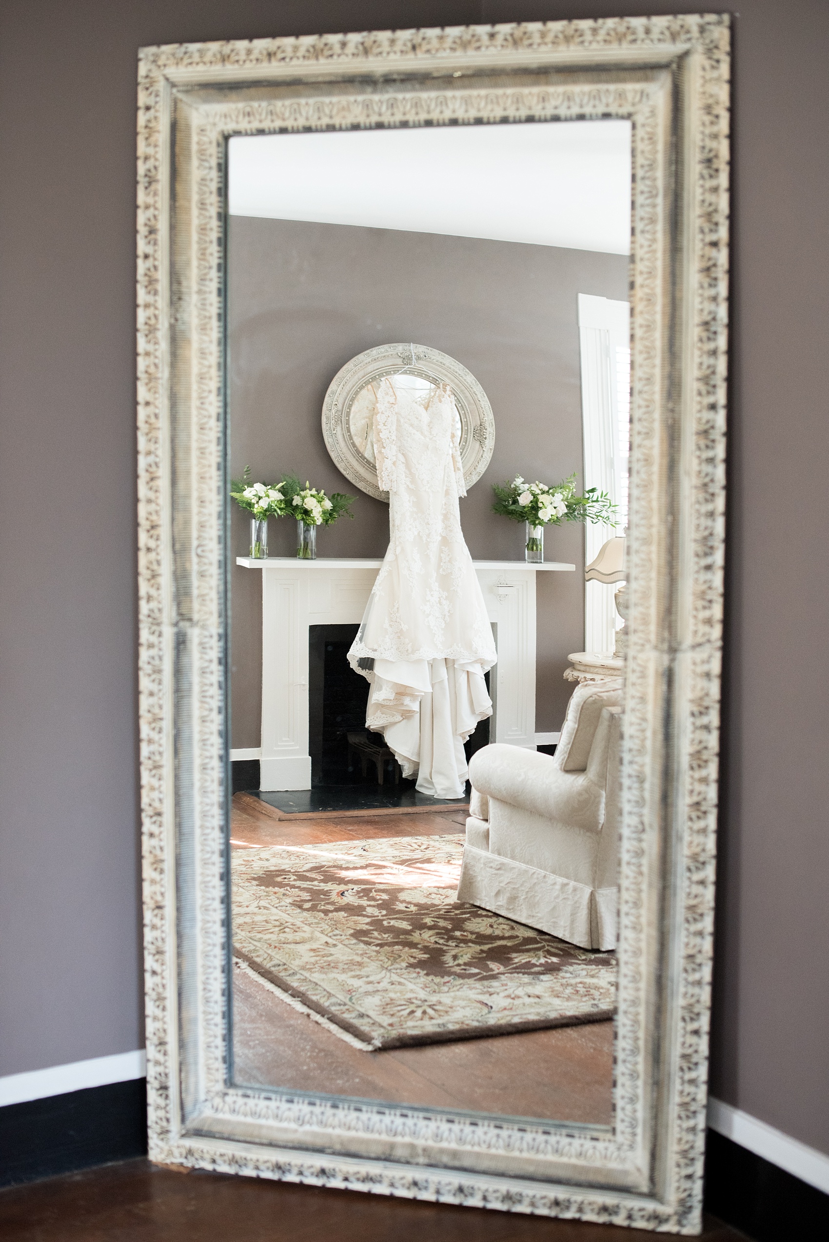 The Sutherland Wedding Photos by Mikkel Paige Photography. A picture of the bride's lace long-sleeve Pronovias gown.