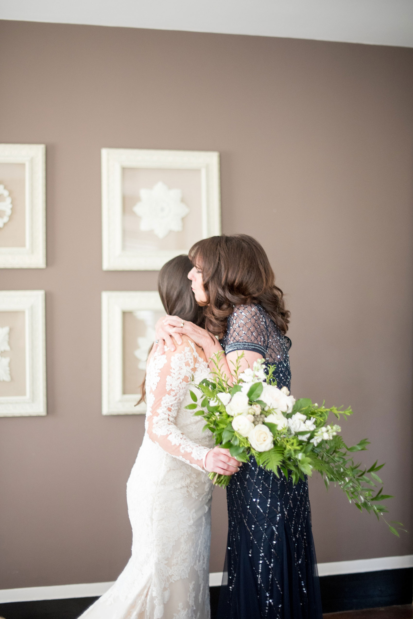 The Sutherland Wedding Photos by Mikkel Paige Photography. Picture of the bride and mother hugging in her bridal suite.