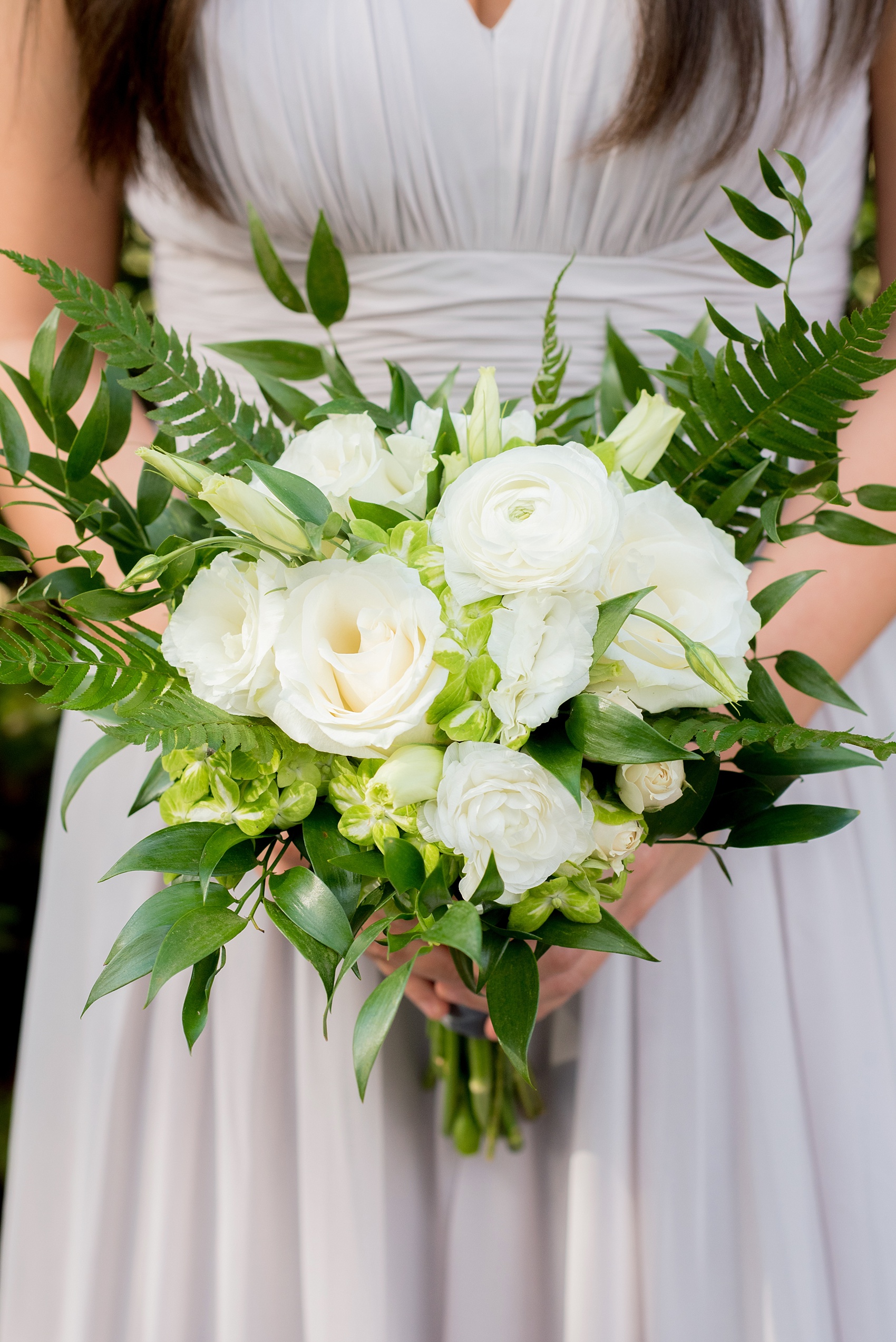 The Sutherland Wedding Photos by Mikkel Paige Photography. A bridesmaid in grey chiffon gown with green and white bouquet by Eclectic Sage.