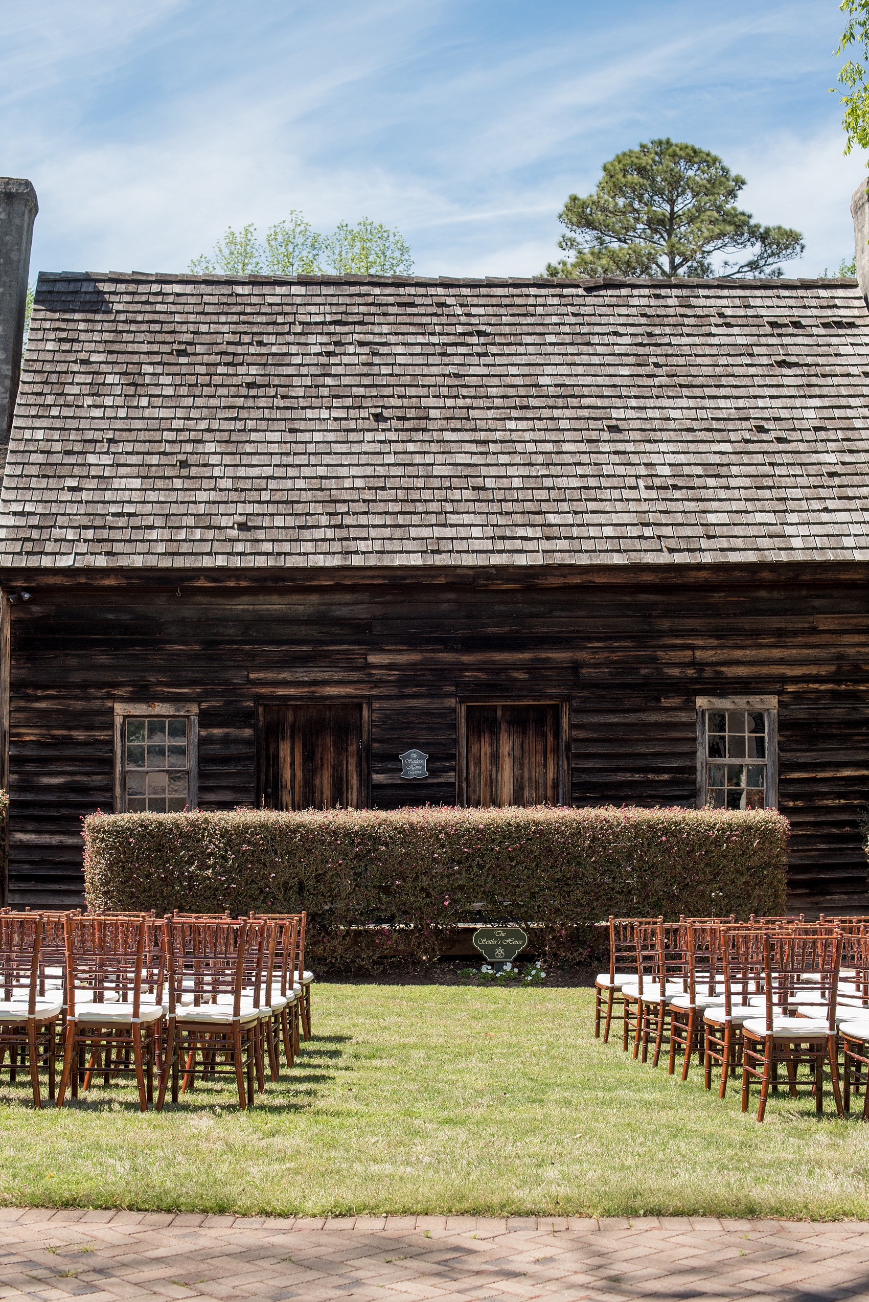 The Sutherland Wedding Photos by Mikkel Paige Photography. A simple outdoor ceremony in front of a rustic barn. Planning by A Southern Soiree.