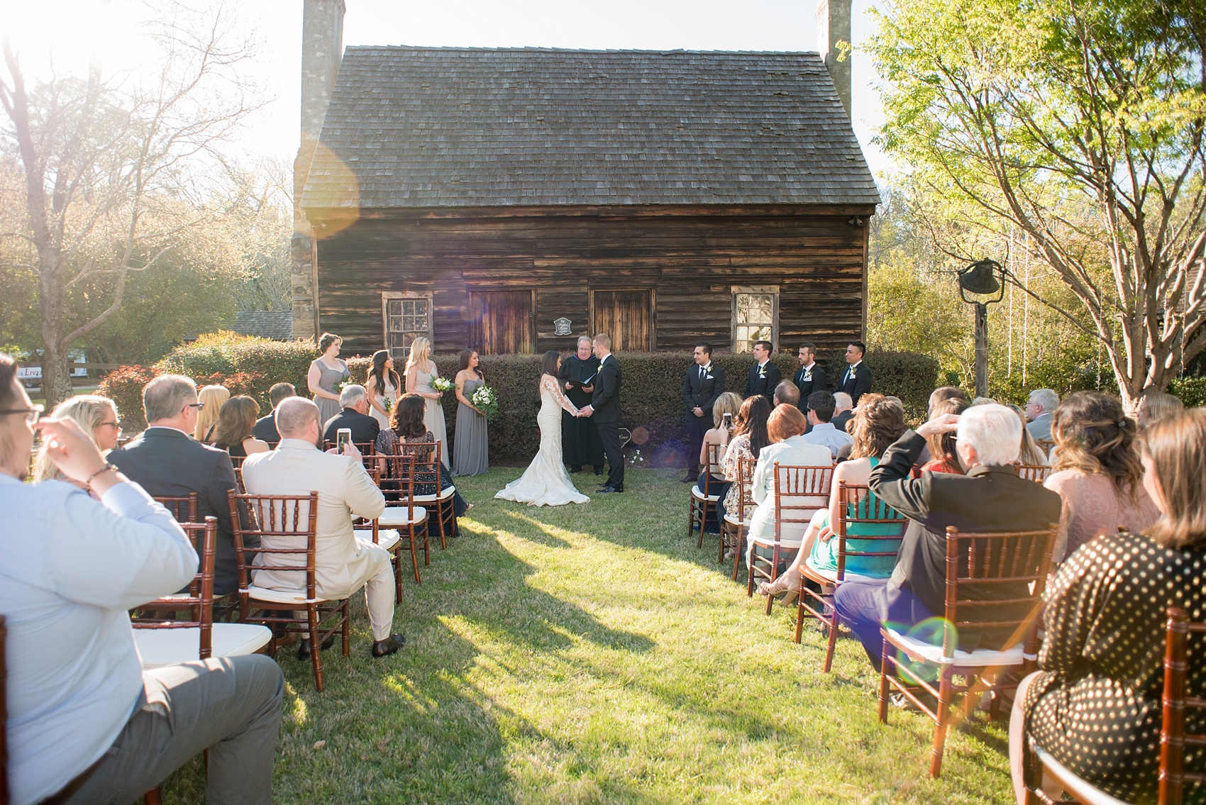 The Sutherland Wedding Photos by Mikkel Paige Photography. A simple outdoor ceremony in front of a rustic barn. Planning by A Southern Soiree.