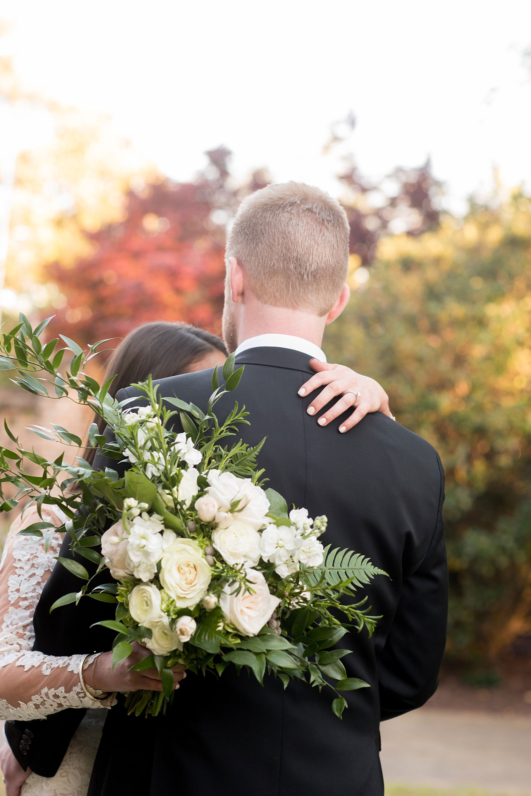 The Sutherland Wedding Photos by Mikkel Paige Photography. Bride and groom picture with a lace Pronovias gown and classic black tuxedo. Planning by A Southern Soiree. Green and white floral bouquet by Eclectic Sage.