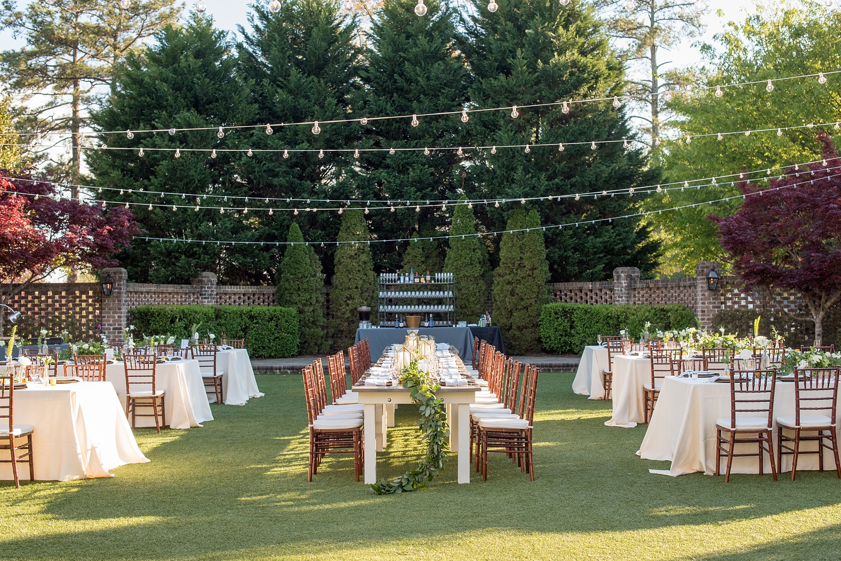 The Sutherland Wedding Photos by Mikkel Paige Photography. Outdoor reception in the walled garden with market lights.