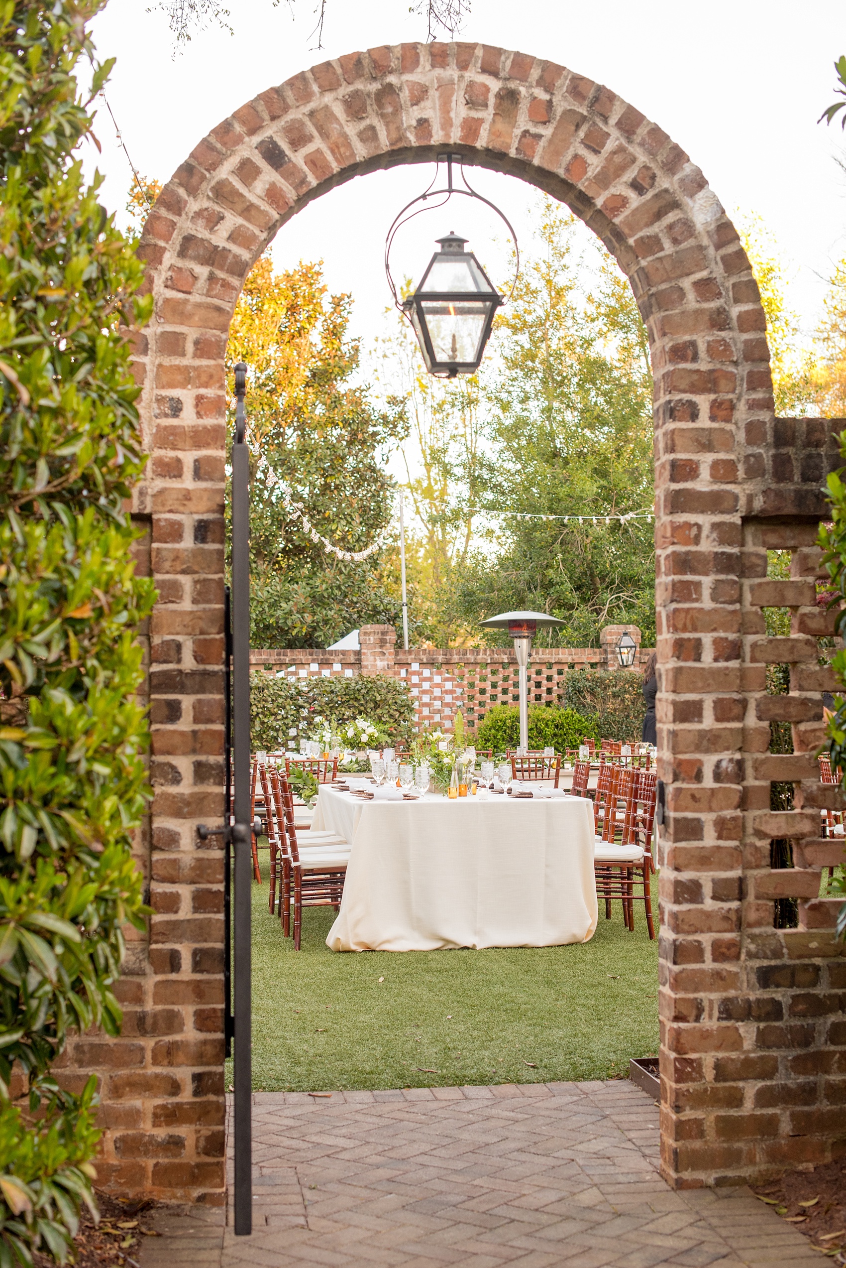 The Sutherland Wedding Photos by Mikkel Paige Photography. Outdoor reception in the walled garden with market lights.