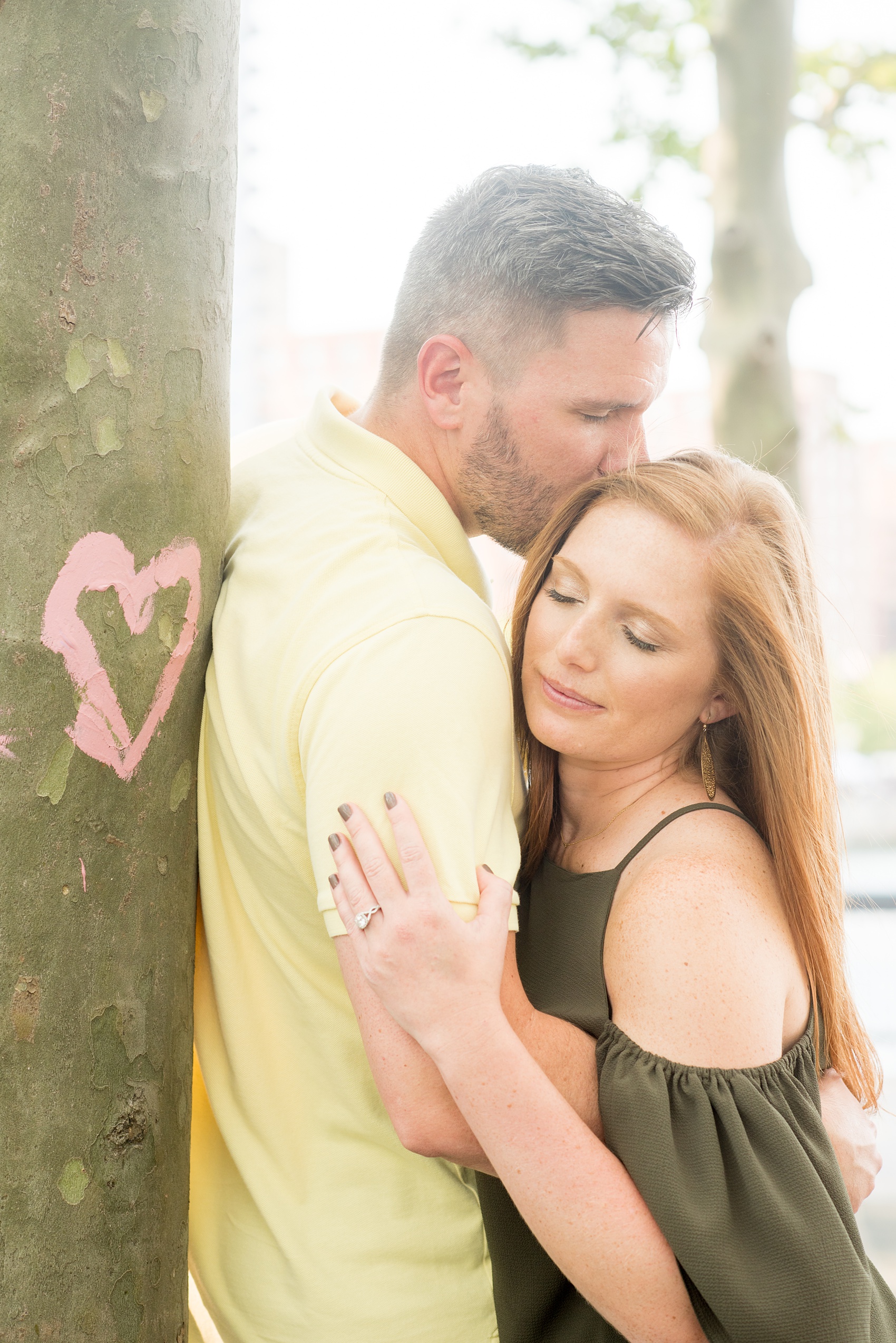 Spring Hoboken Engagement Photos by Mikkel Paige Photography. Picture of the groom sweetly kissing the bride.