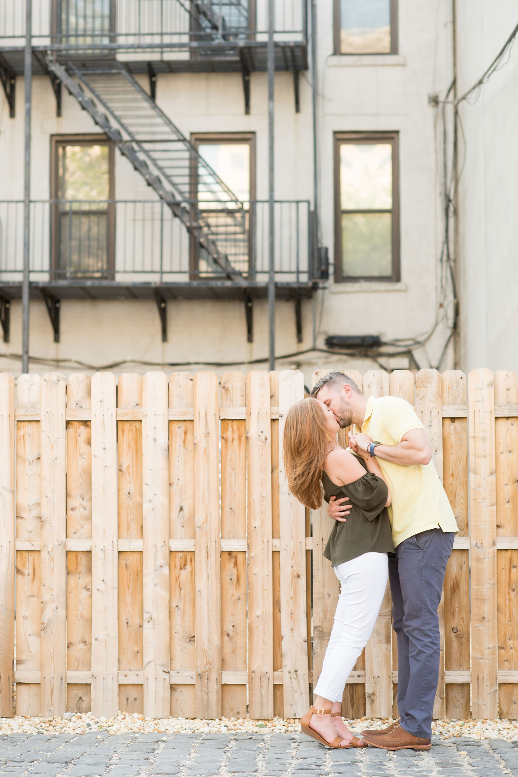 Spring Hoboken Engagement Photos by Mikkel Paige Photography. Picture of the couple in an urban city setting.