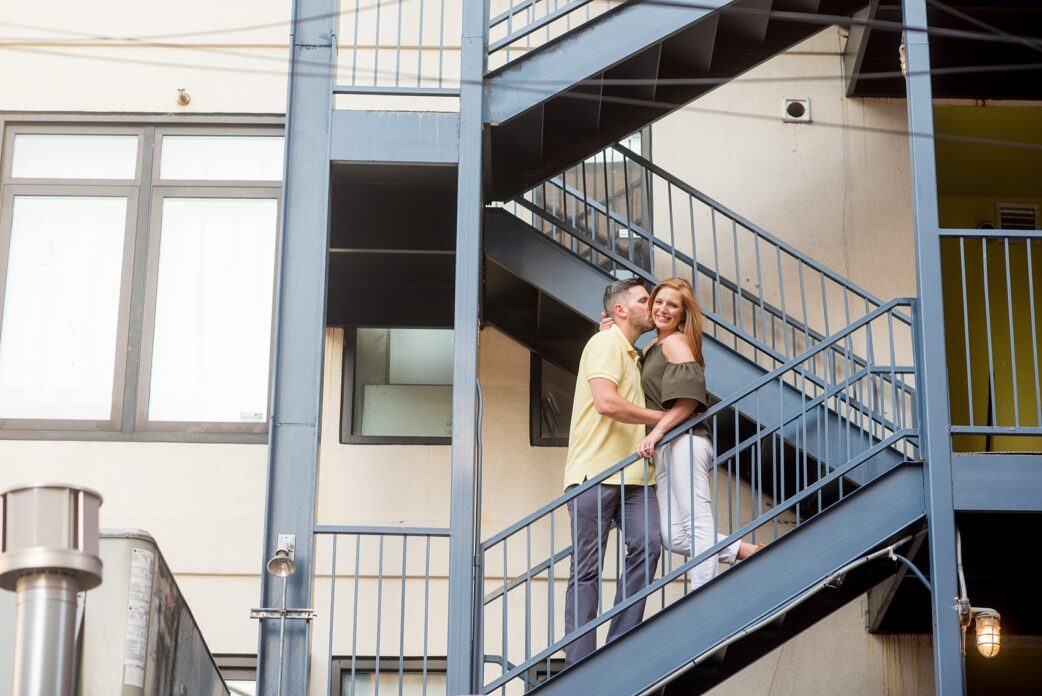 Spring Hoboken Engagement Photos by Mikkel Paige Photography. Urban environment including a rustic city staircase.