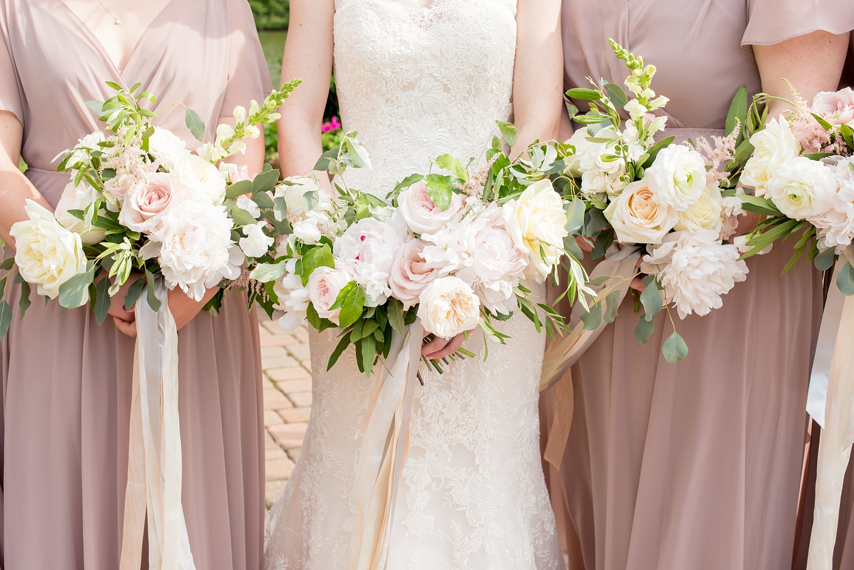 The Pavilions at Angus Barn wedding photos by Mikkel Paige Photography. Flowers by Meristem Floral with bridesmaids in mauve, dusty rose gowns.