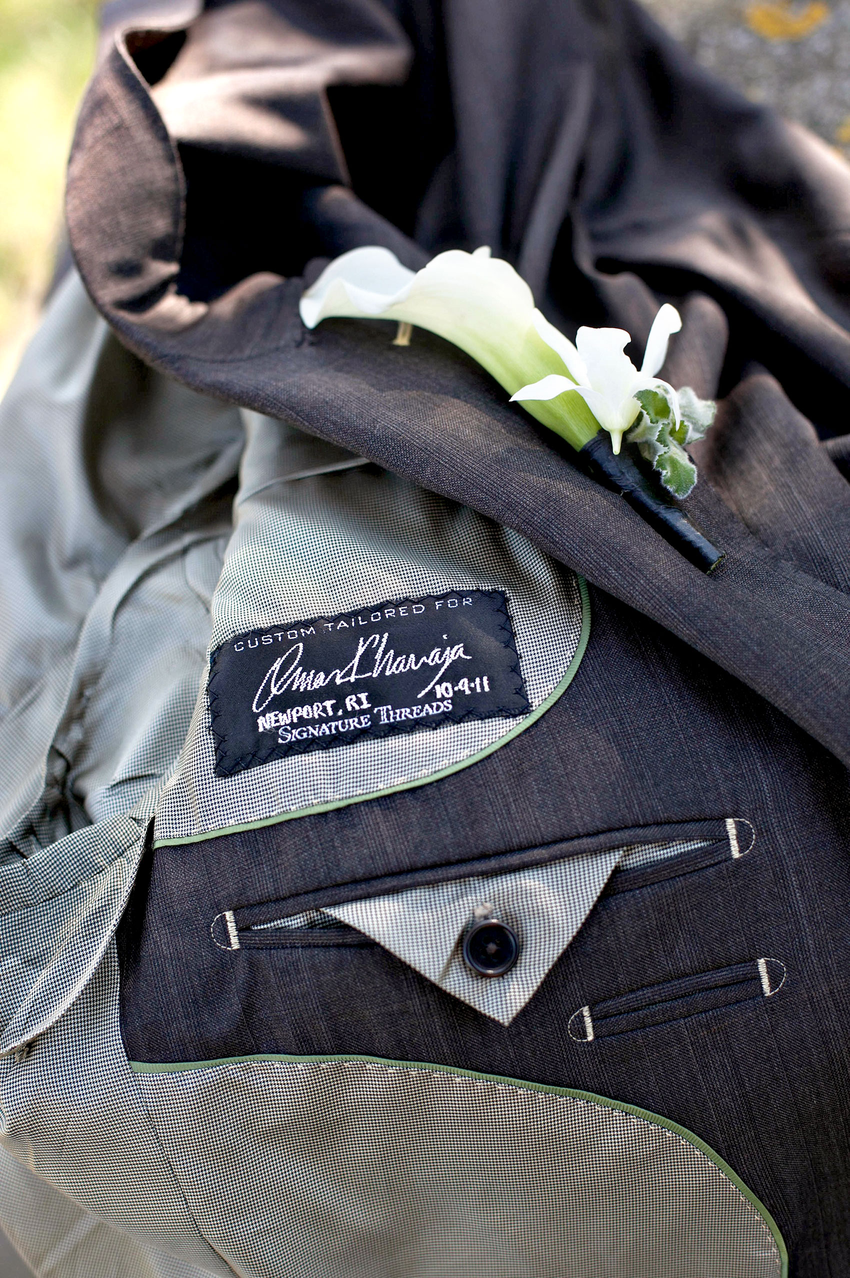 Castle Hill Inn wedding photos by Mikkel Paige Photography in Newport, Rhode Island. Detail picture of the groom's embroidery in his suit jacket. 