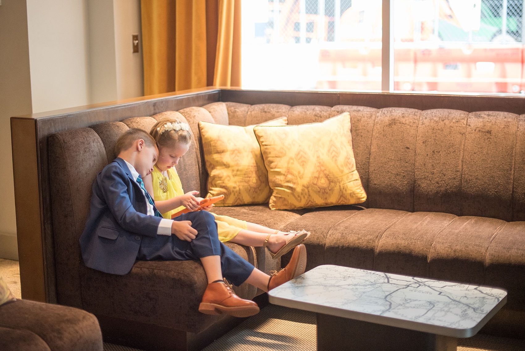 The Cookery Durham wedding photos by Mikkel Paige Photography. Picture of the flower girl and bride's son relaxing before the ceremony.