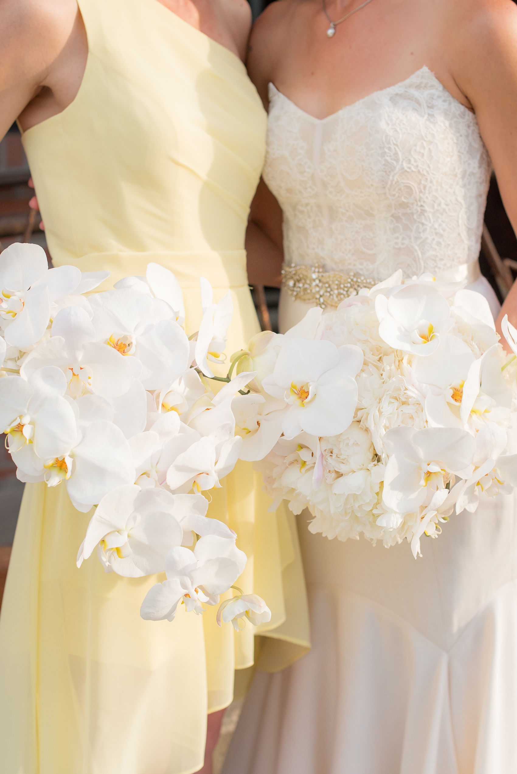 The Cookery Durham wedding photos by Mikkel Paige Photography. Picture of the orchid bouquets for the bride and maid of honor, only bridesmaids.