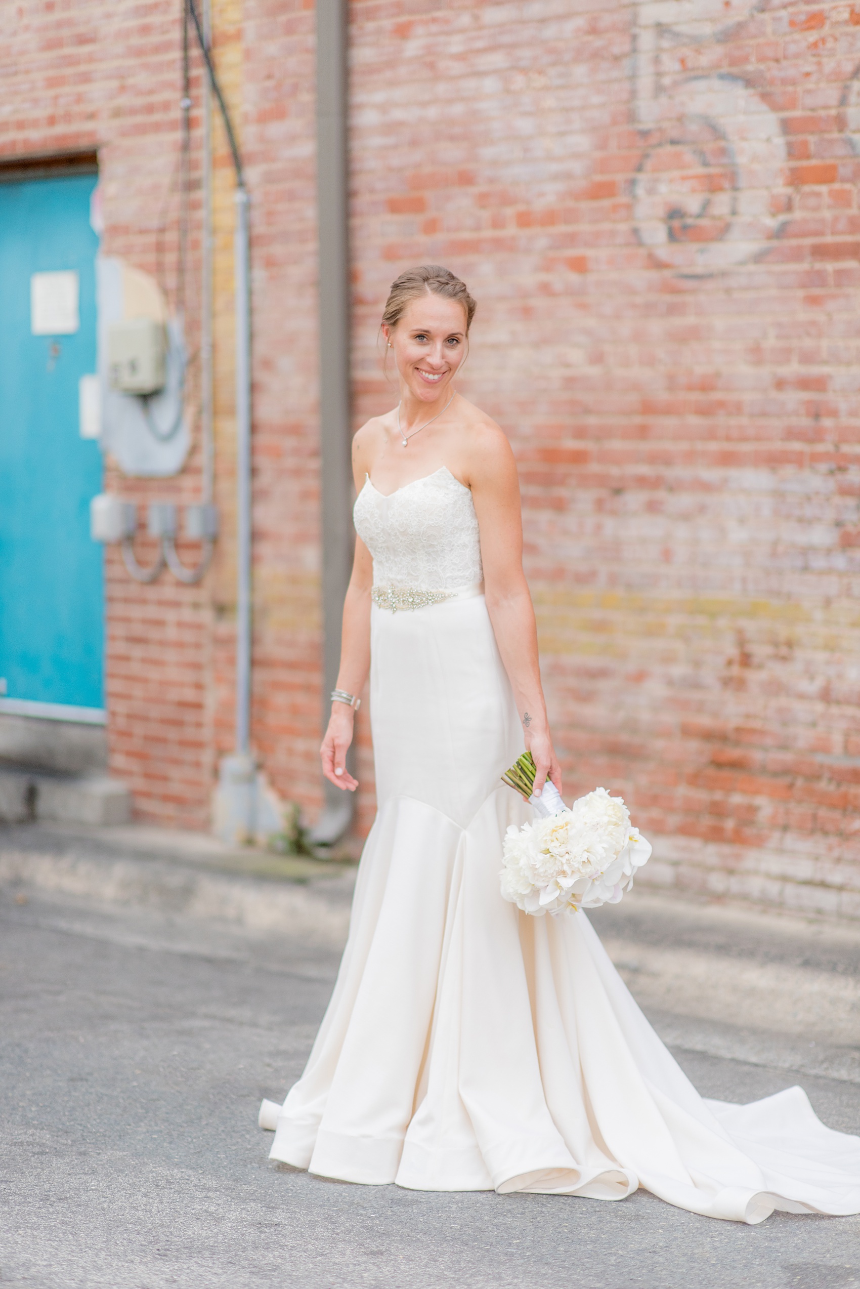 The Cookery Durham wedding photos by Mikkel Paige Photography. Picture of the bride in a strapless lace gown and white orchid bouquet by Tre Bella.