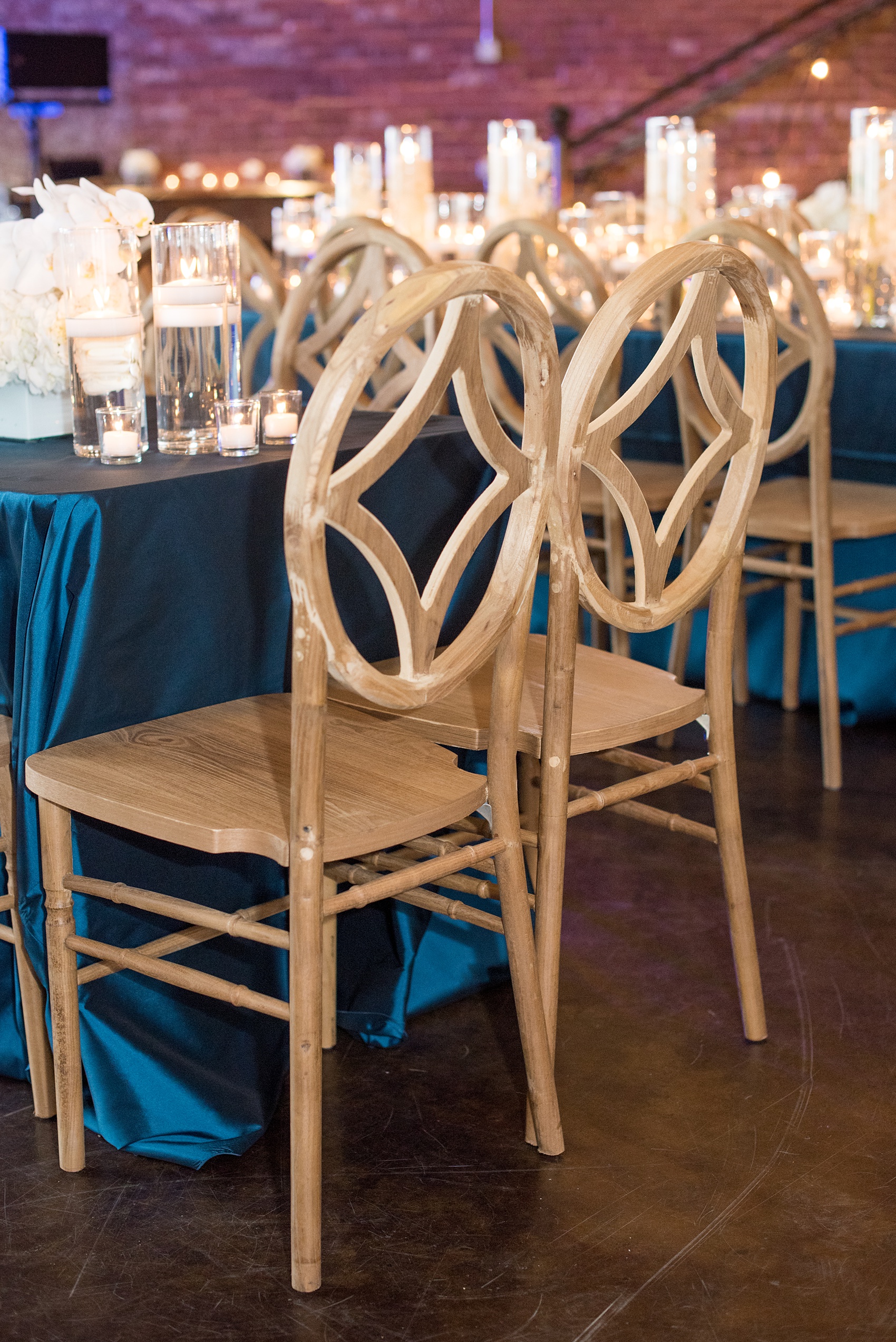 The Cookery Durham wedding photos by Mikkel Paige Photography. Picture of the custom wood chairs by American Party Rentals. Planning by Erin McLean Events.