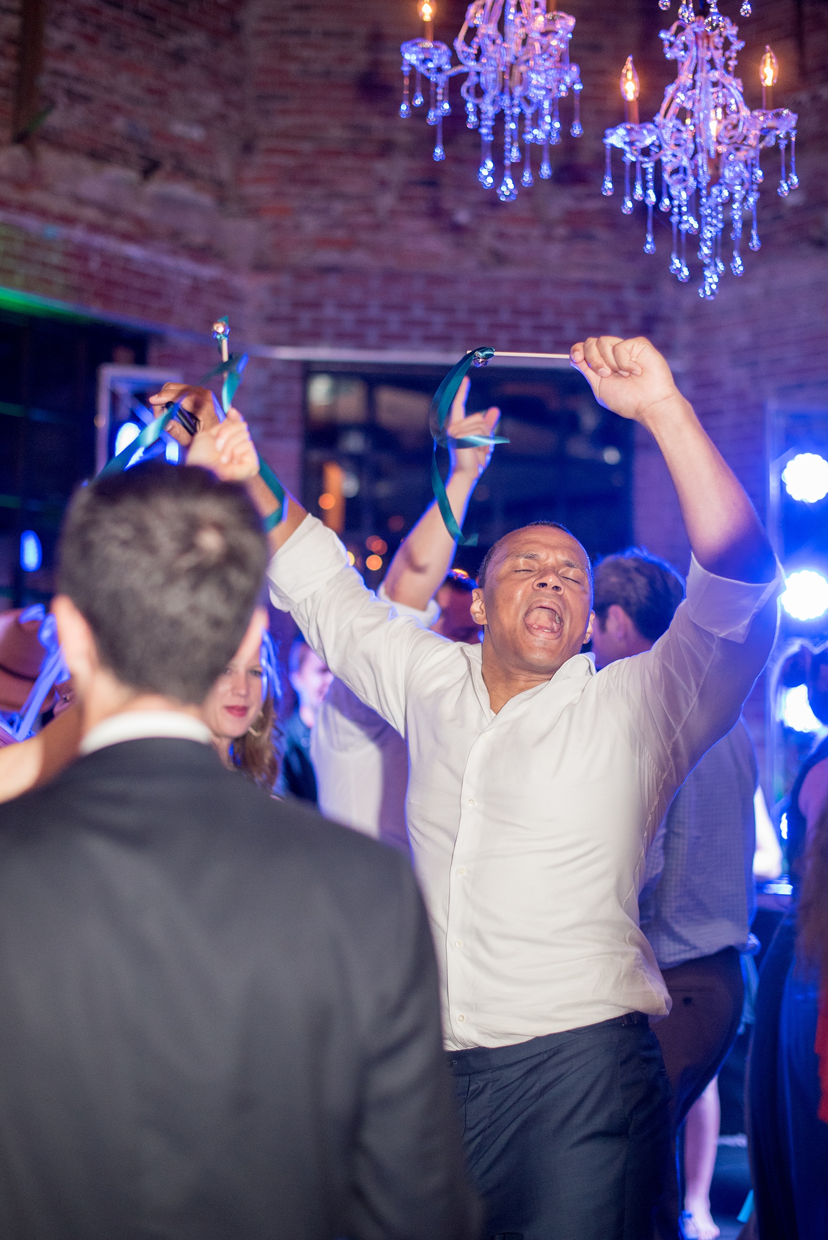 The Cookery Durham wedding photos by Mikkel Paige Photography. Picture of the guests dancing with ribbon wands.