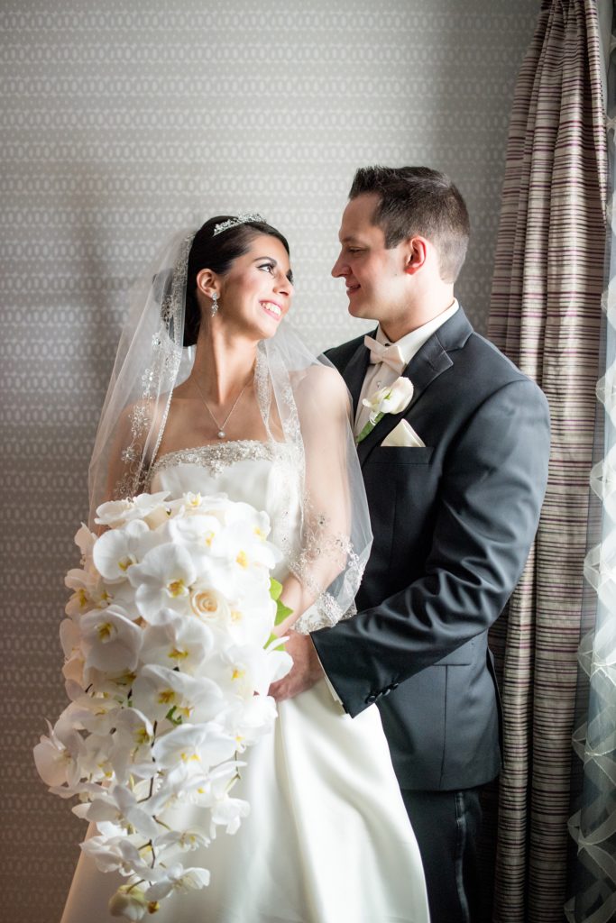 Mikkel Paige Photography wedding photos at The Fox Hollow, NY. Bride and groom with an orchid bouquet.