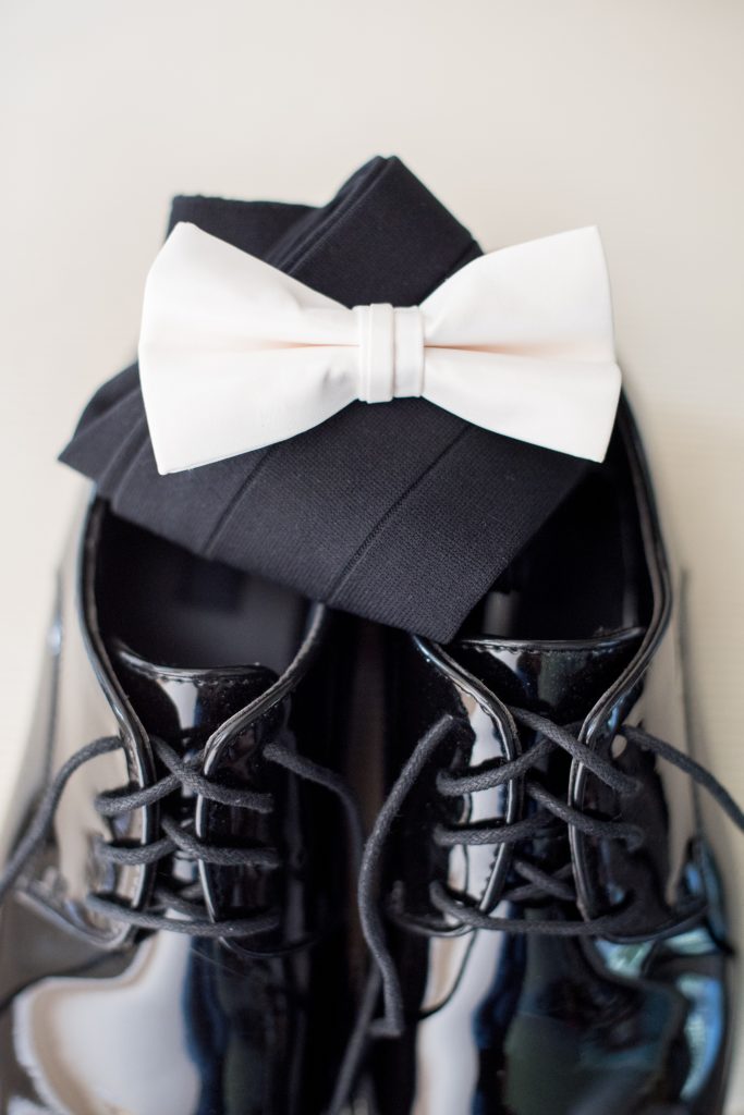 Mikkel Paige Photography wedding photos at The Fox Hollow, Long Island. A detail picture of the groom's white bow tie and shoes.