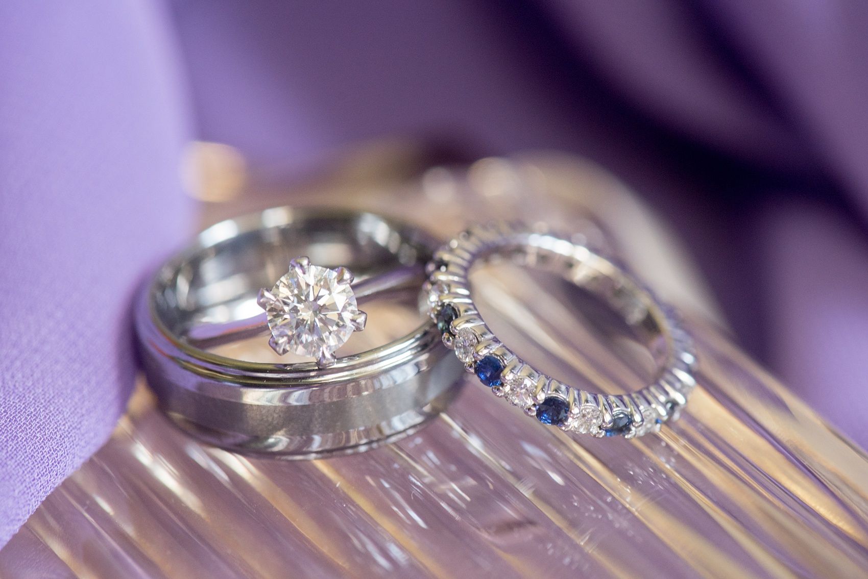 Mikkel Paige Photography wedding photos at The Fox Hollow, Long Island. Detail picture of the rings, including a sapphire and diamond wedding band.