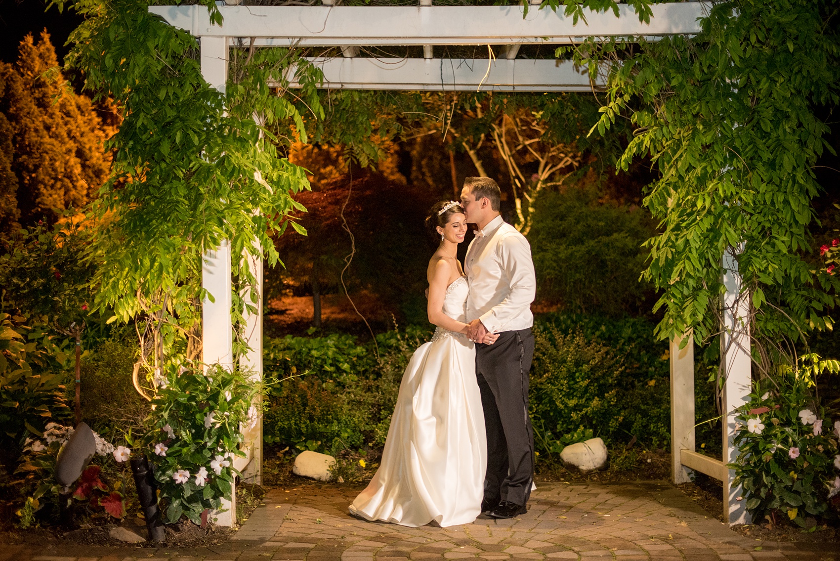 Mikkel Paige Photography wedding photos at The Fox Hollow. Outdoor garden night picture of the bride and groom.