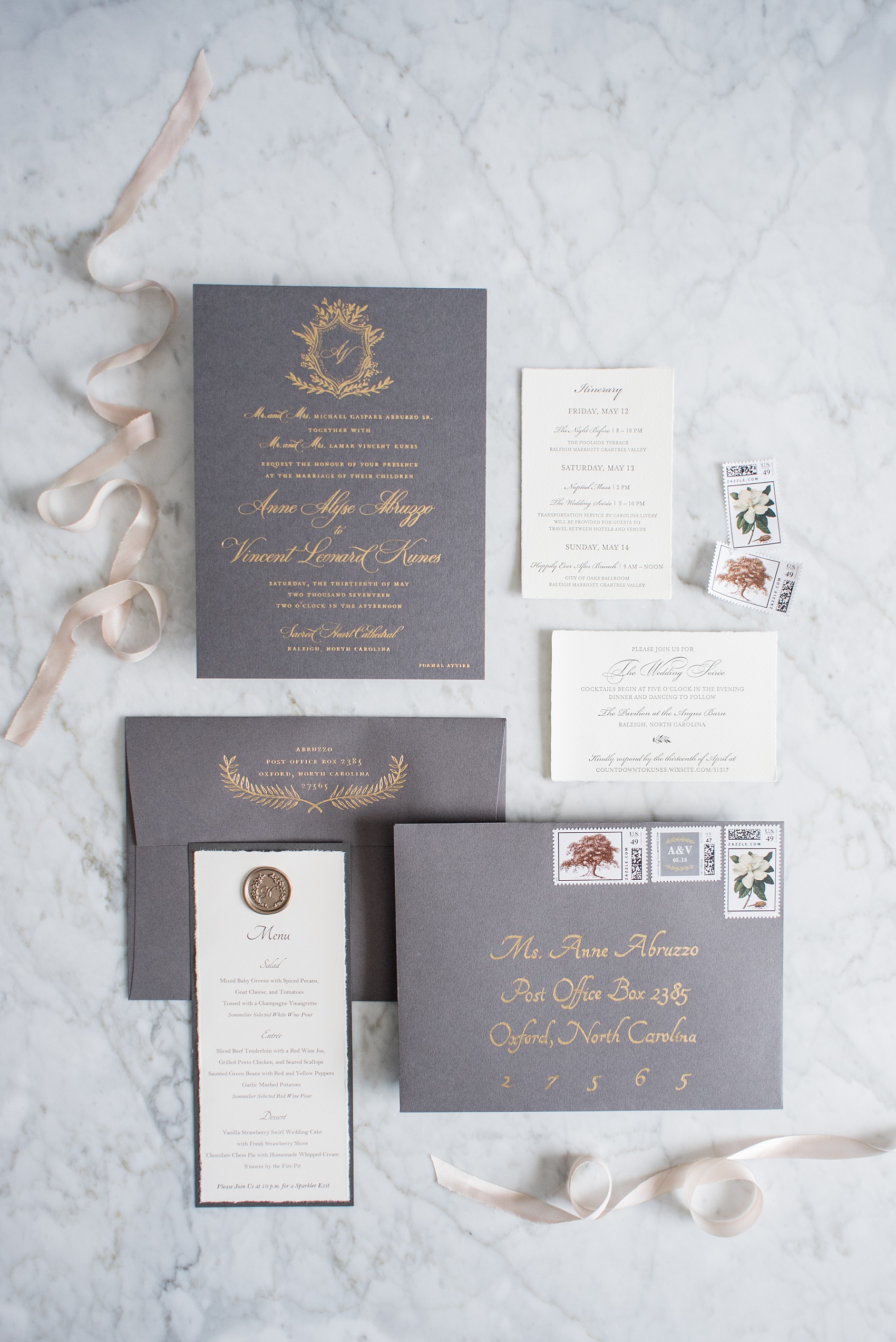 Pavilion at Angus Barn wedding photos by Mikkel Paige Photography. Detail picture of the grey and gold invitation suite.