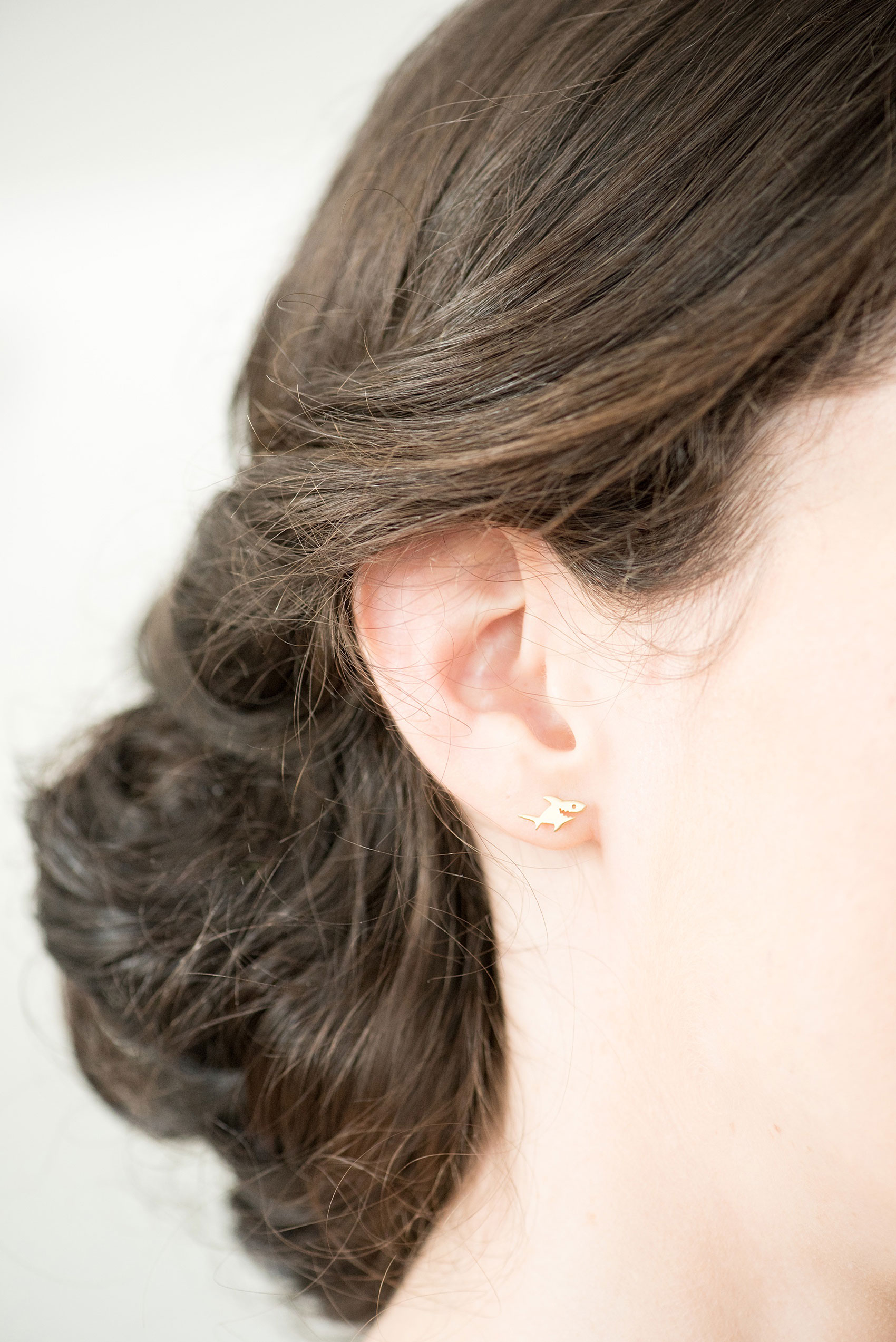 Pavilion at Angus Barn wedding photos by Mikkel Paige Photography. Detail picture of the bride's shark earrings.