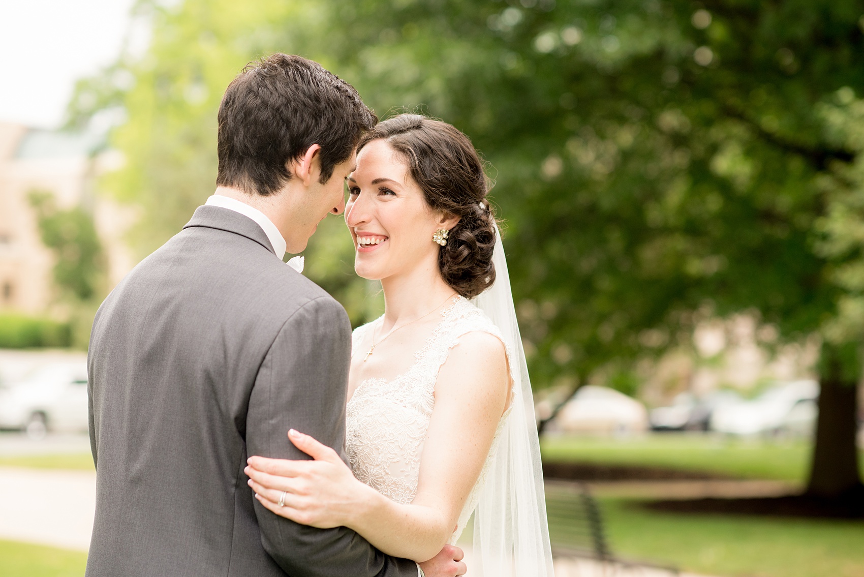 Wedding photos by Mikkel Paige Photography. Picture of the bride and groom at the Raleigh capitol building during a spring day.