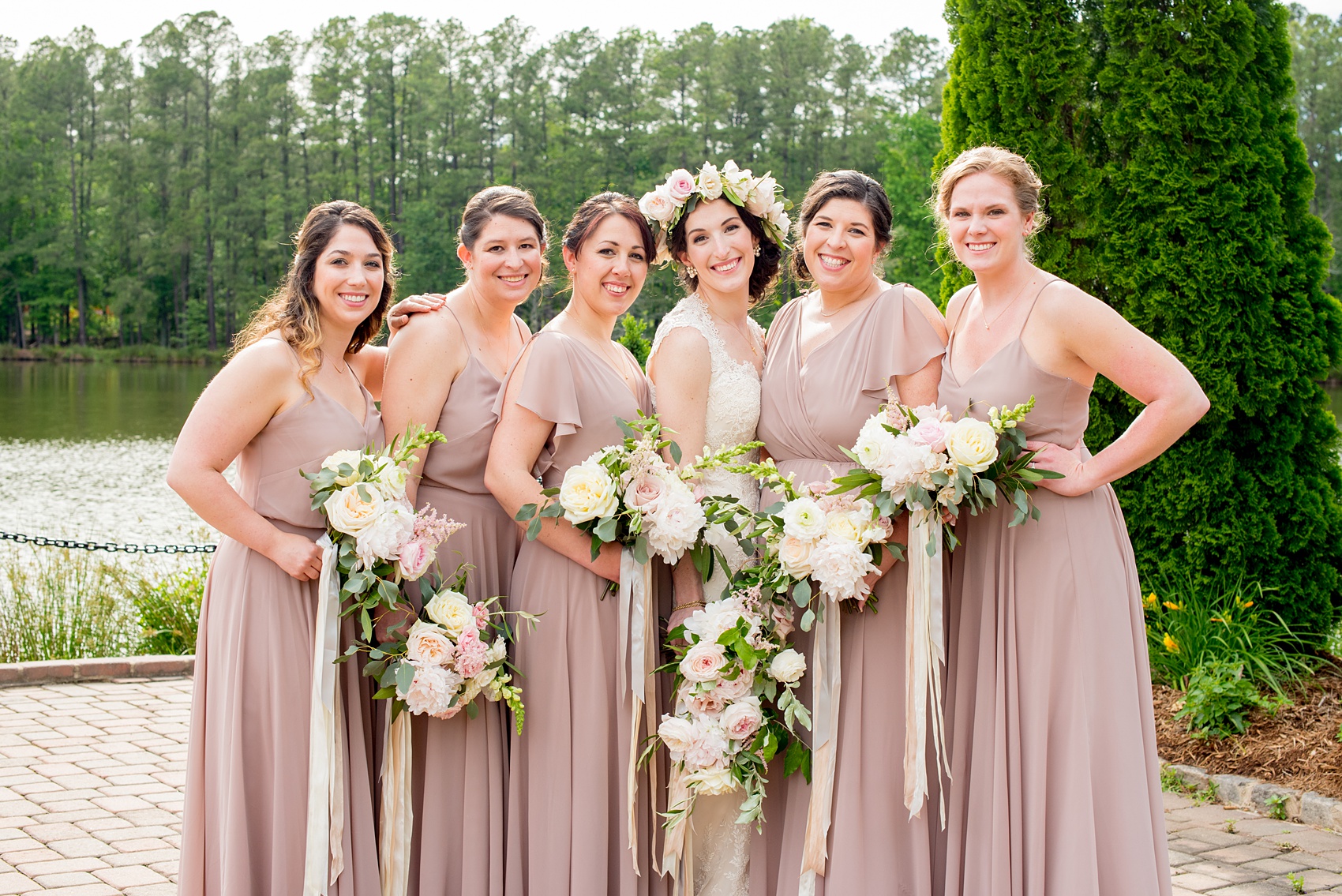 Pavilion at Angus Barn wedding photos by Mikkel Paige Photography. Unique picture of the bridal party with the bridesmaids in dusty rose mismatched chiffon Jenny Yoo gowns.