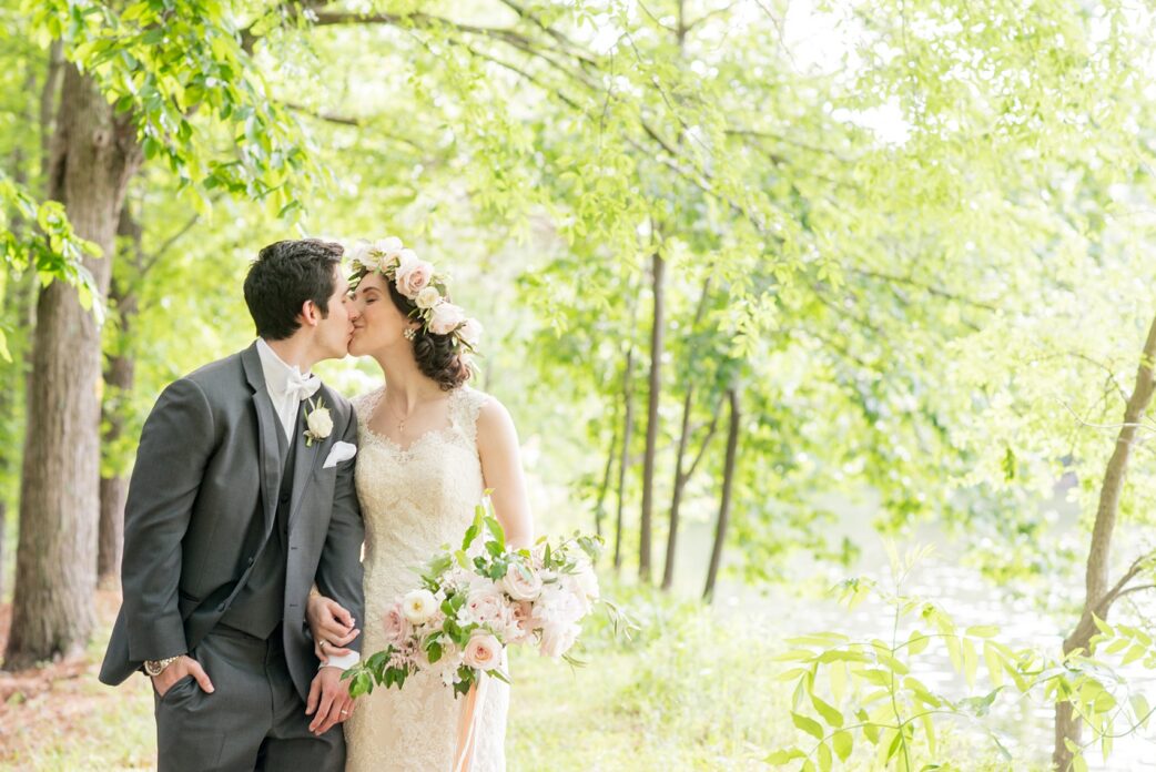 Pavilion at Angus Barn wedding photos by Mikkel Paige Photography. Raleigh spring celebration with a picture of the bride and groom kissing in the woods.