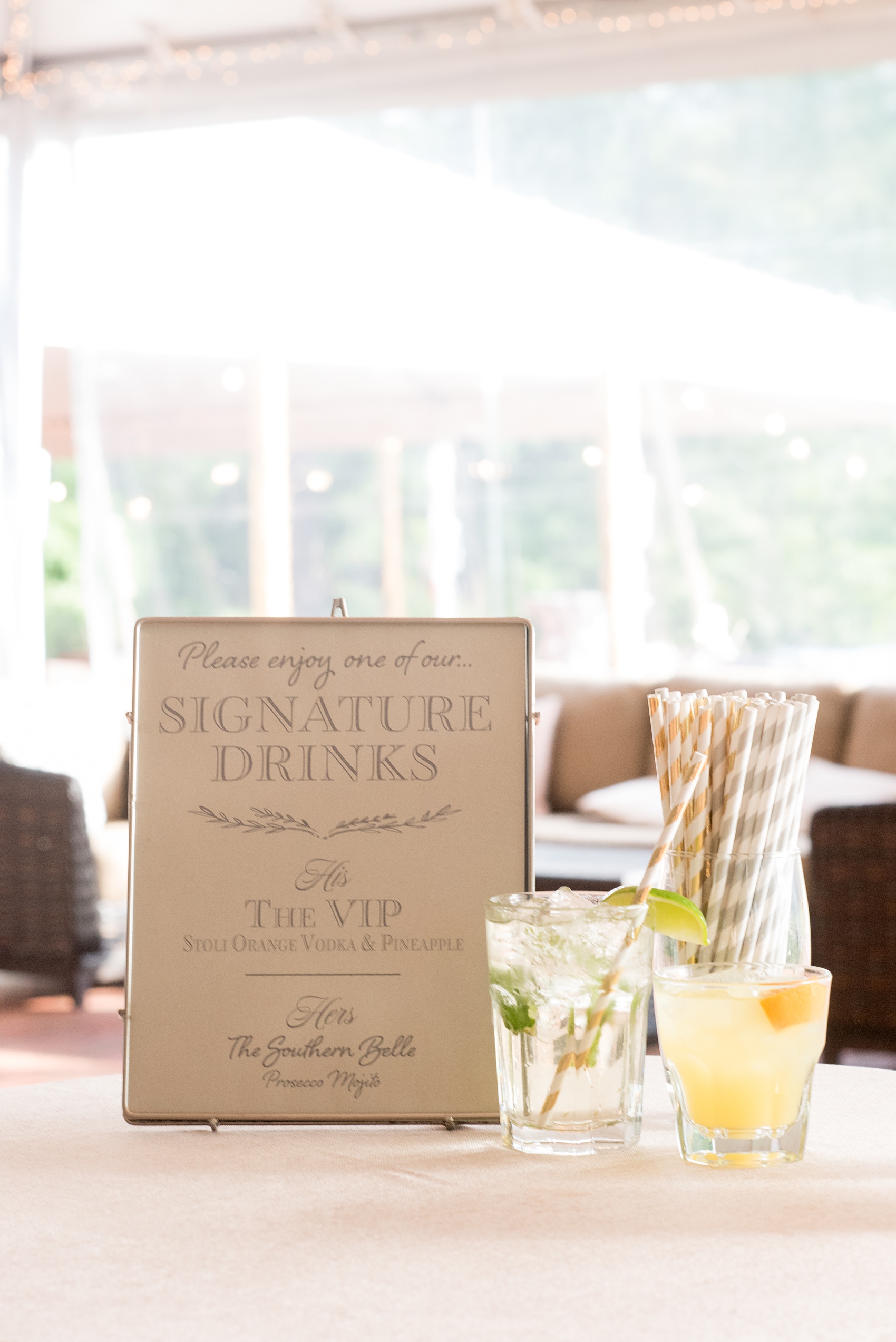 Pavilion at Angus Barn wedding photos by Mikkel Paige Photography. Picture of the signature drink signage - a VIP (Vodka Infused Pineapple) and Southern Belle (champagne mojito).