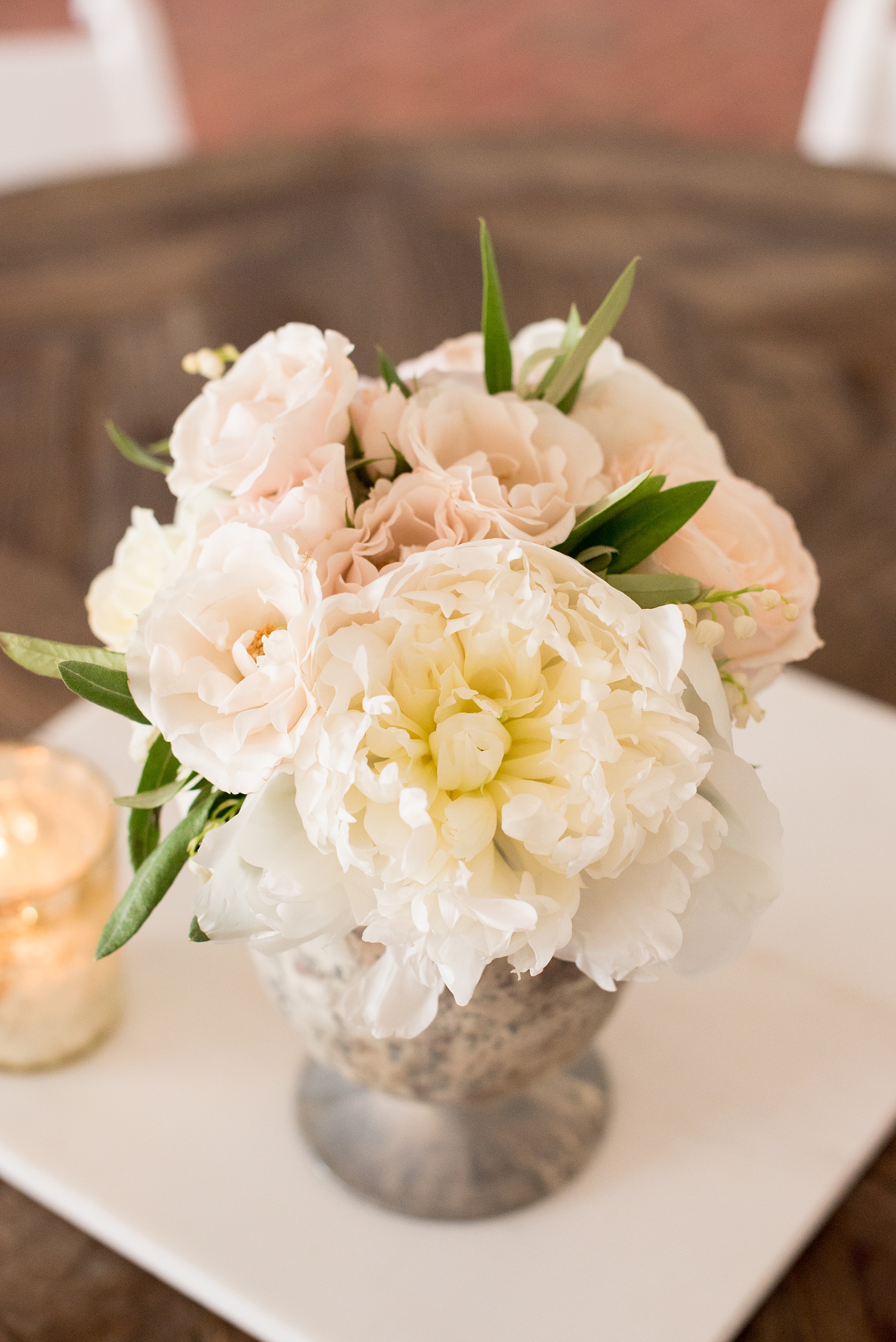 Pavilion at Angus Barn wedding photos by Mikkel Paige Photography. Picture of the cocktail table low centerpieces with peonies and roses by Meristem Floral.