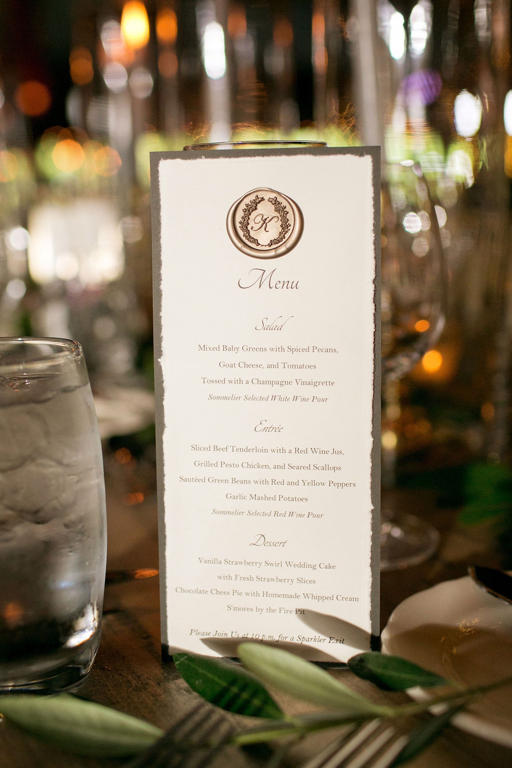 Pavilion at Angus Barn wedding photos by Mikkel Paige Photography. Picture of the menu with the couple's signature monogram wax seal.