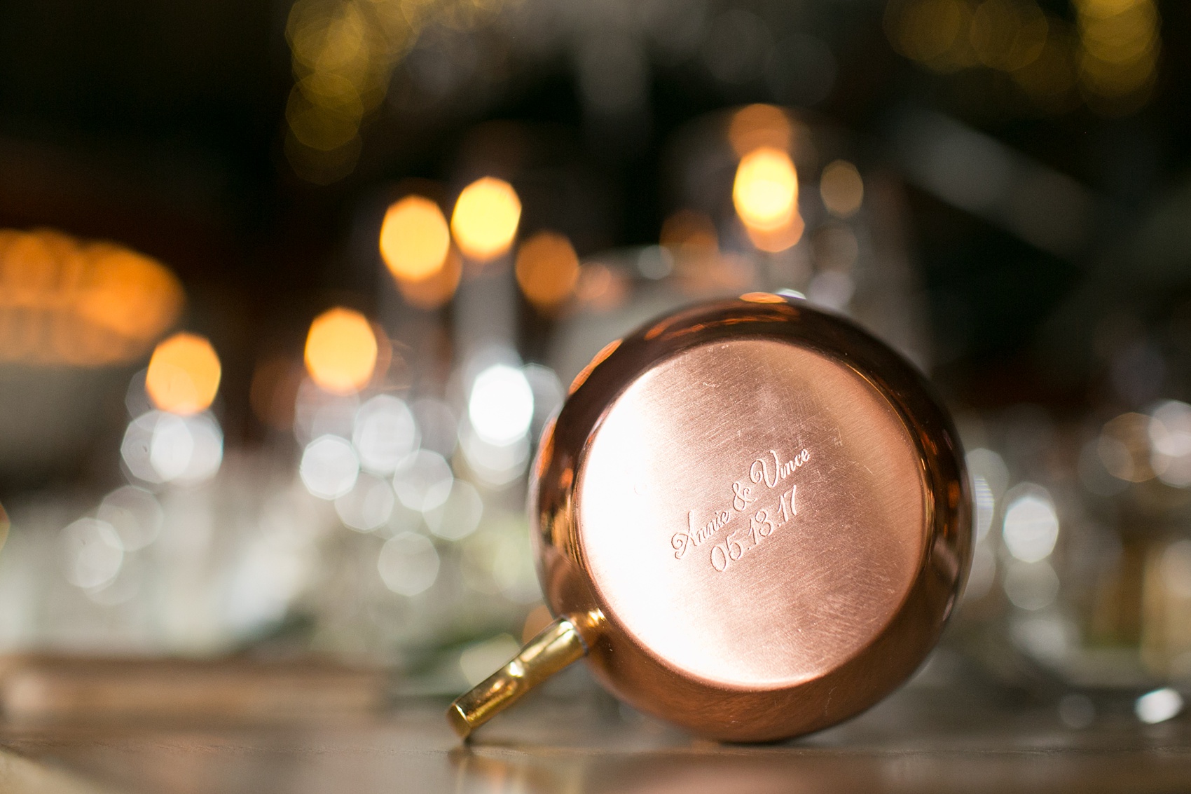 Pavilion at Angus Barn wedding photos by Mikkel Paige Photography. Picture of the engraving detail on the custom copper mug guest favors.